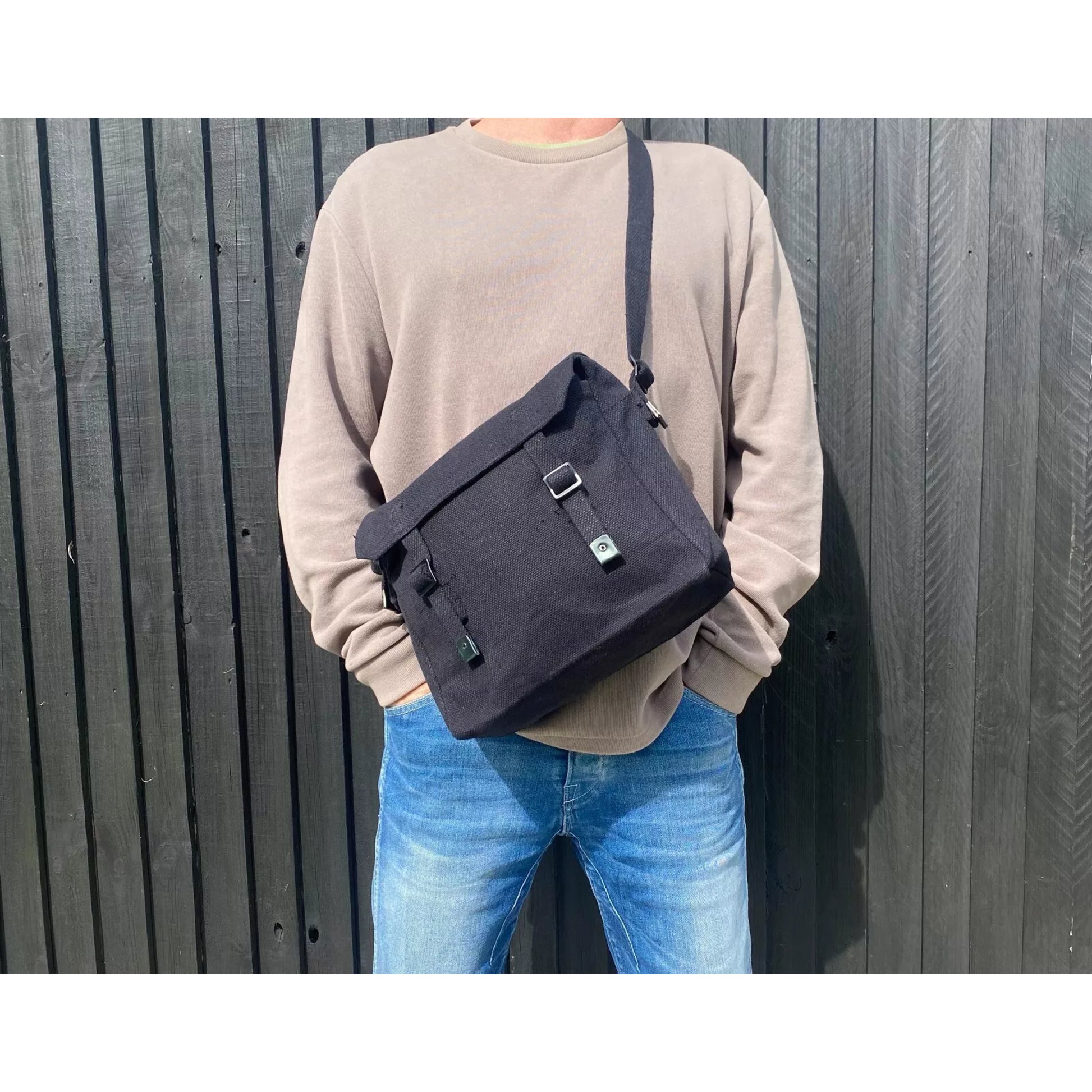 Canvas army military style shoulder bag with adjustable strap and buckle fastening in black