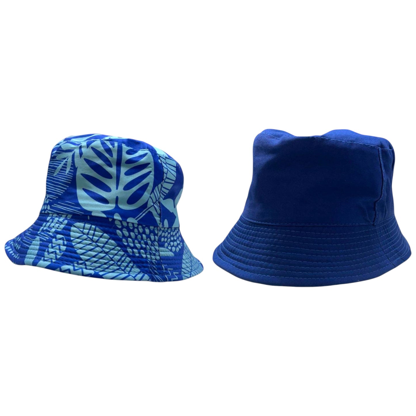 Kids reversible bucket hat with blue tropical leaf print on one side and solid navy blue on the other, lightweight cotton sun hat for boys and girls.