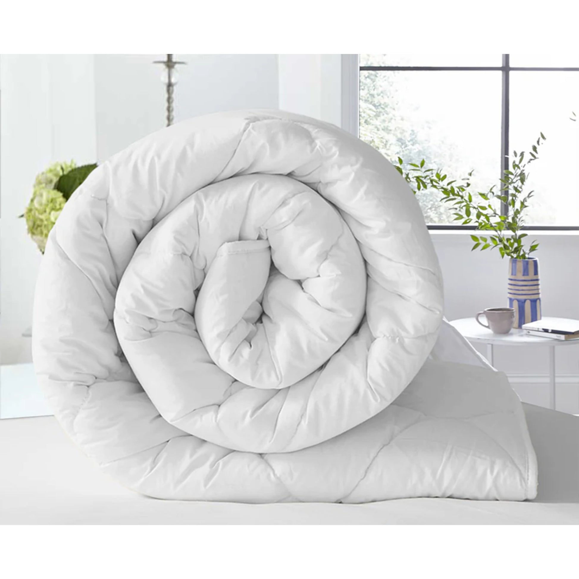 Soft and lightweight white duvet, perfect for all-season comfort. hypoallergenic, breathable duvet adds luxury and warmth to any bedroom. Single, Double King.