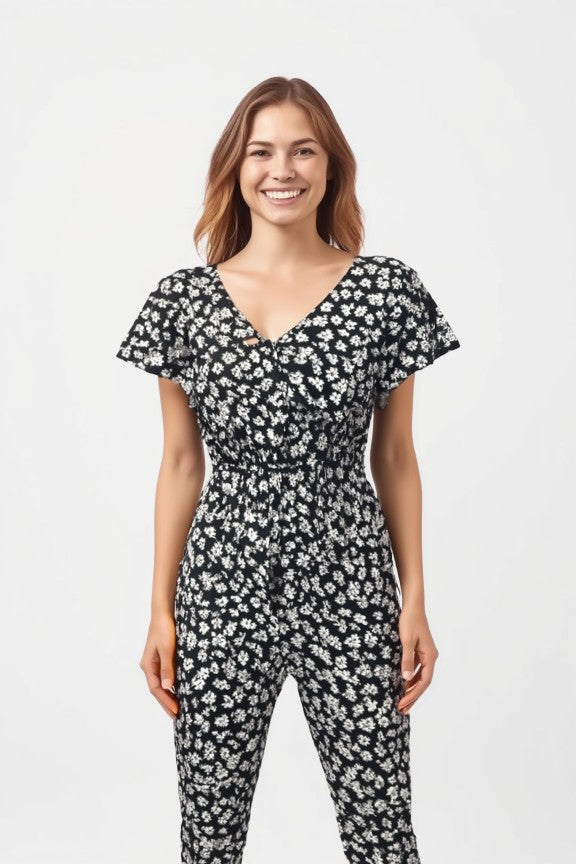 Women's floral print jumpsuit in black with short sleeves and shirred waist