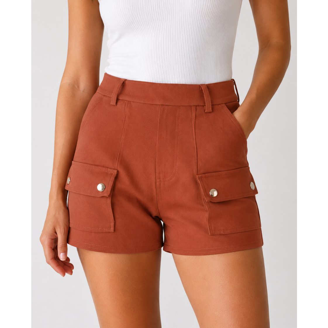 Ladies' terracotta brown fashion shorts with front flap pockets and silver button detail – high-waisted smart casual summer shorts