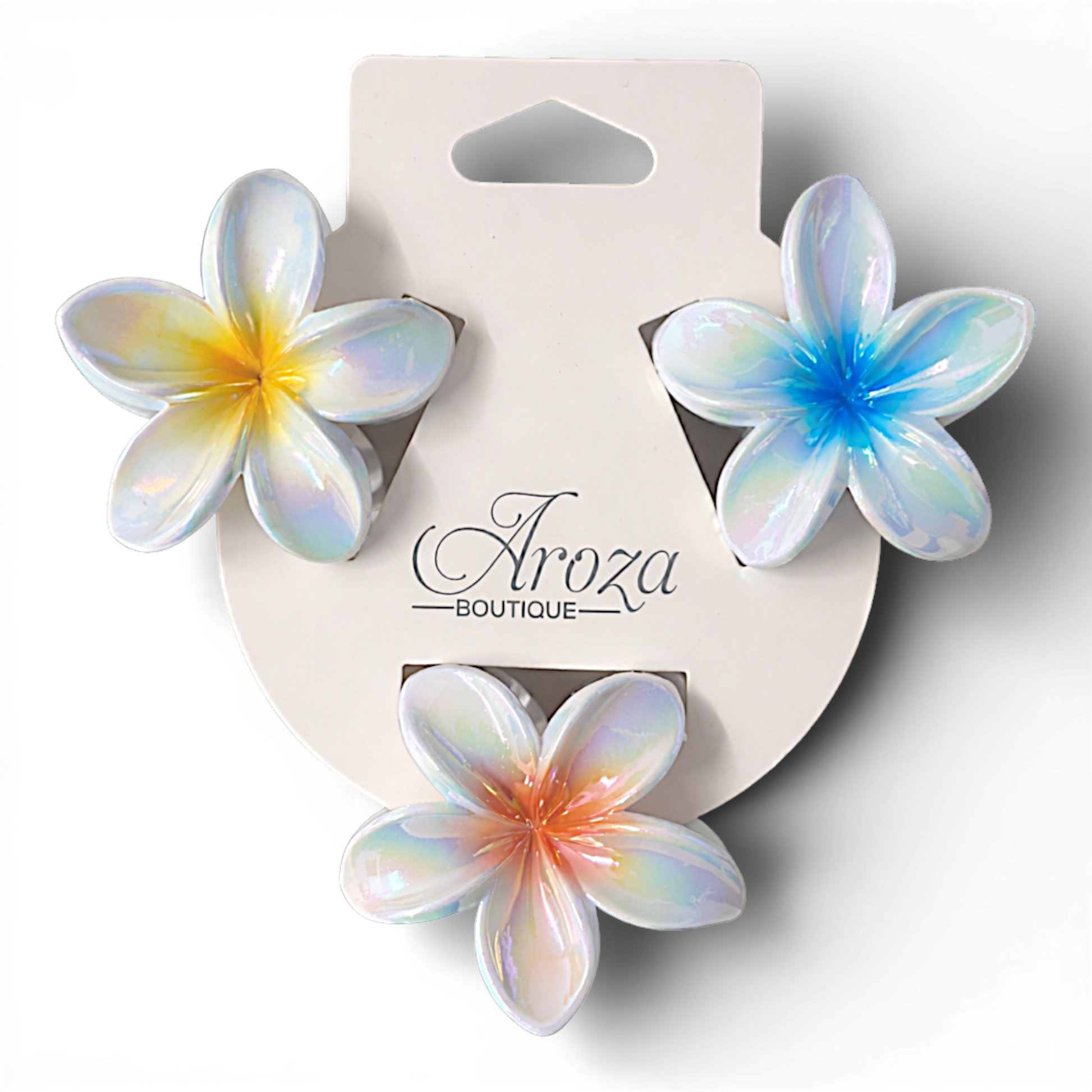 Add a touch of tropical elegance to your look with these iridescent plumeria flower hair clips. Featuring a glossy, pearlescent finish with a soft colour-fade centre, these lightweight claw clips catch the light beautifully while providing a secure hold.