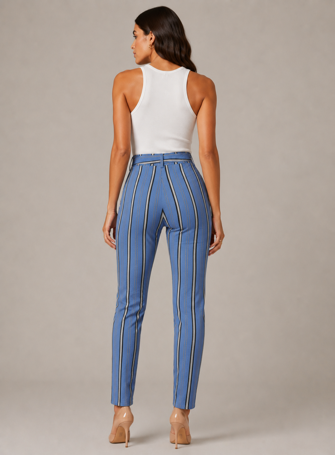 Women's high-waisted belted trousers in blue with vertical black and white stripes, featuring a tie-front waist and slim fit.