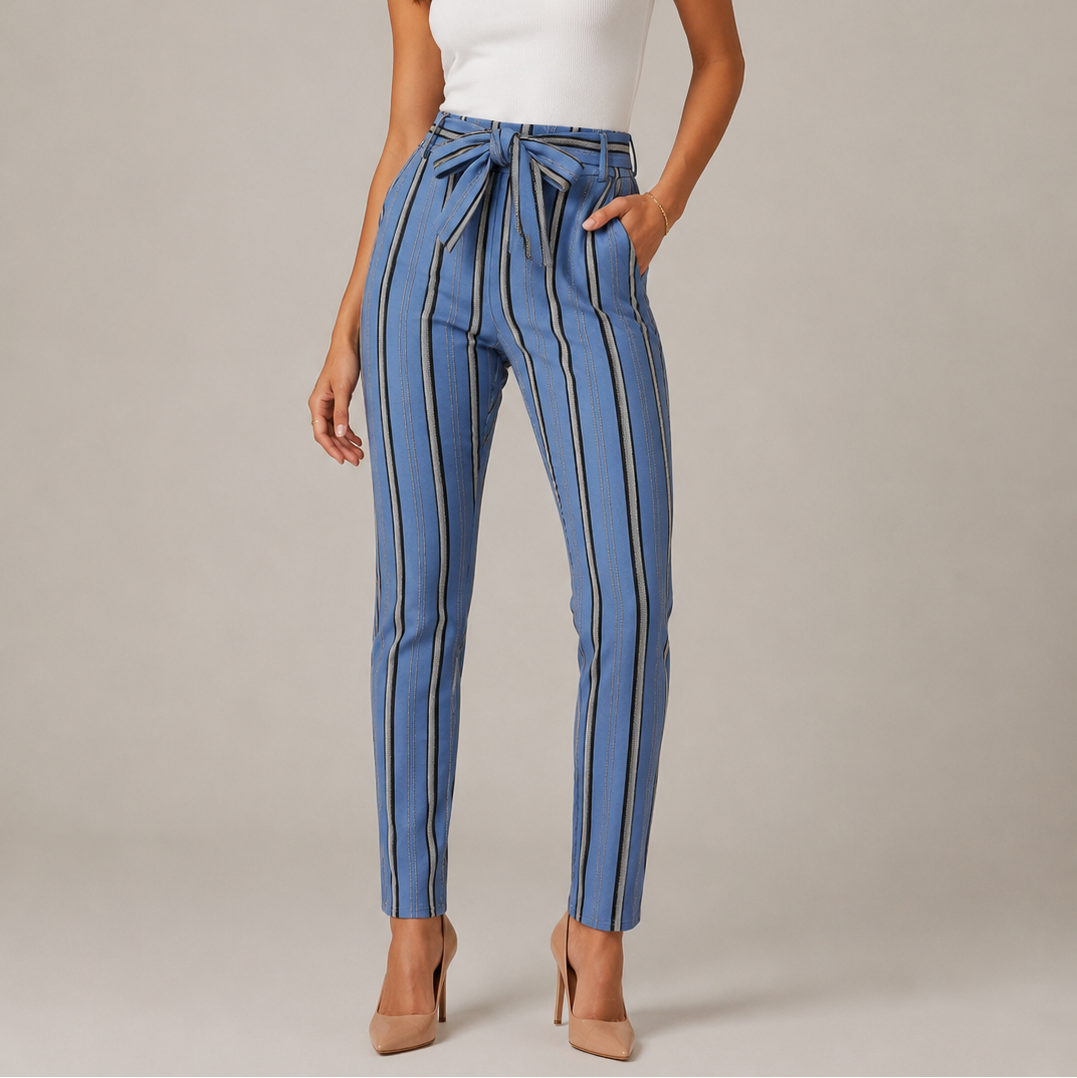 Women's high-waisted belted trousers in blue with vertical black and white stripes, featuring a tie-front waist and slim fit.