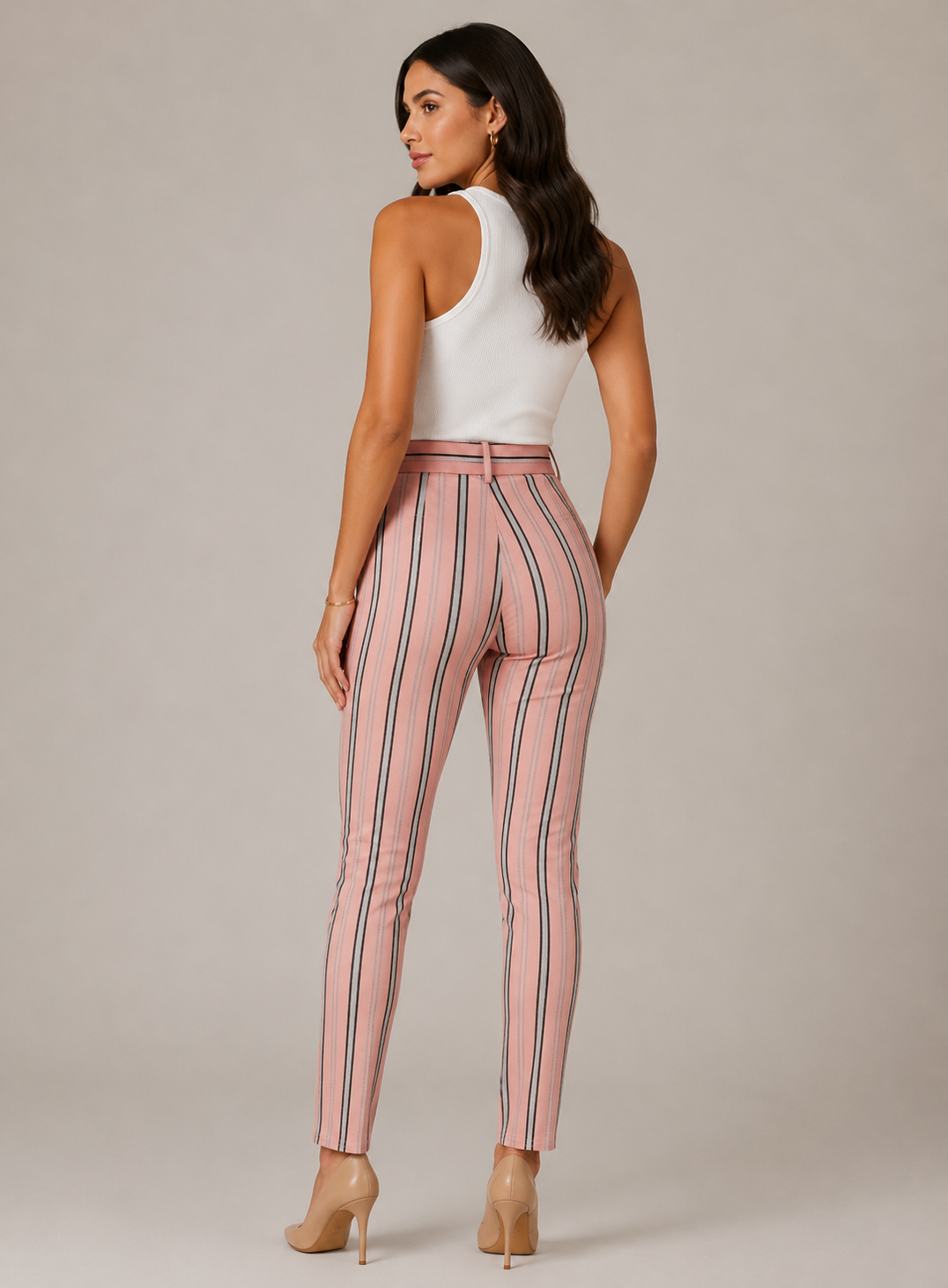 Women's high-waisted belted trousers in pink with vertical black and white stripes, featuring a tie-front waist and slim fit.