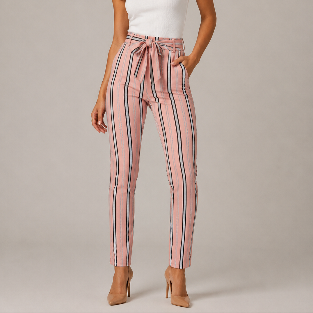 Women's high-waisted belted trousers in pink with vertical black and white stripes, featuring a tie-front waist and slim fit.