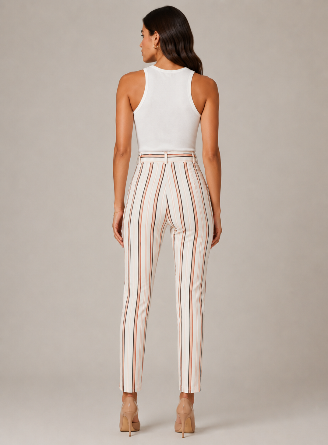 Women's high-waisted belted trousers in white with vertical black and pink stripes, featuring a tie-front waist and slim fit.
