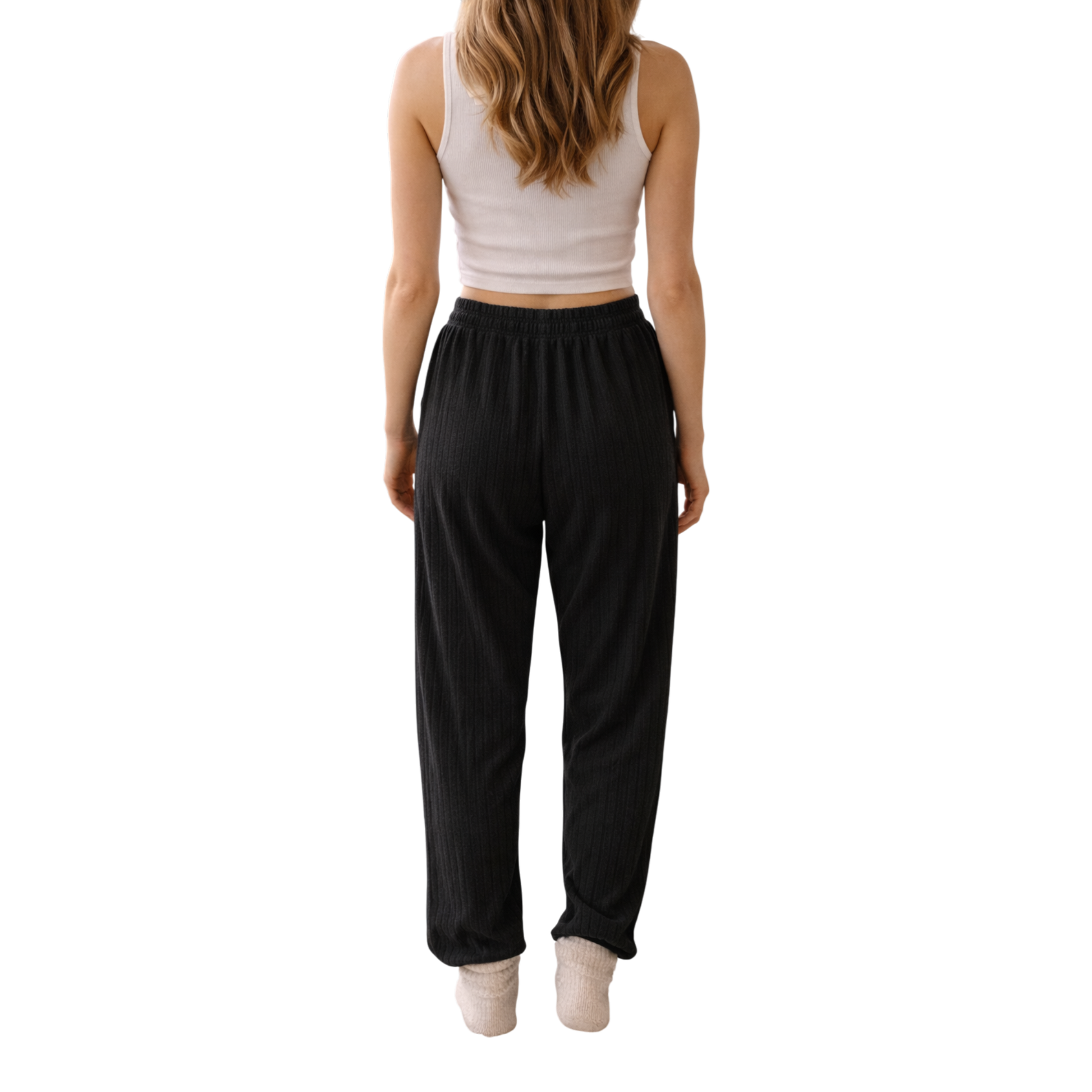Relax in comfort and style with these beautifully soft ribbed lounge trousers. Designed with a flattering relaxed fit and elasticated waistband, they’re perfect for cosy days at home, travel, or casual everyday wear.