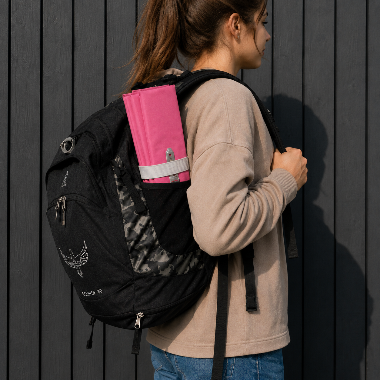 Pink Foldable waterproof camping sit mat with padded cushioning and an elastic carry strap for easy outdoor transport.