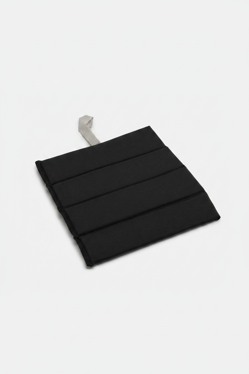 Black Foldable waterproof camping sit mat with padded cushioning and an elastic carry strap for easy outdoor transport.