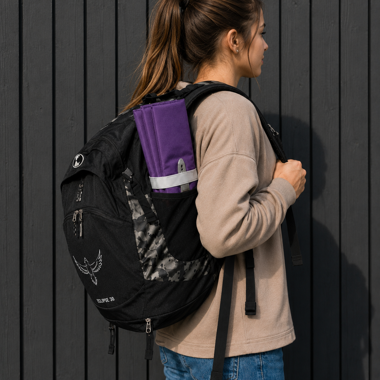 Purple Foldable waterproof camping sit mat with padded cushioning and an elastic carry strap for easy outdoor transport.