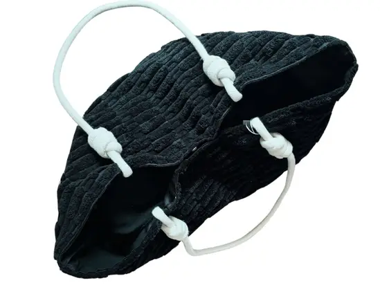 Black spacious towelling tote bag for beach holidays with soft textured fabric