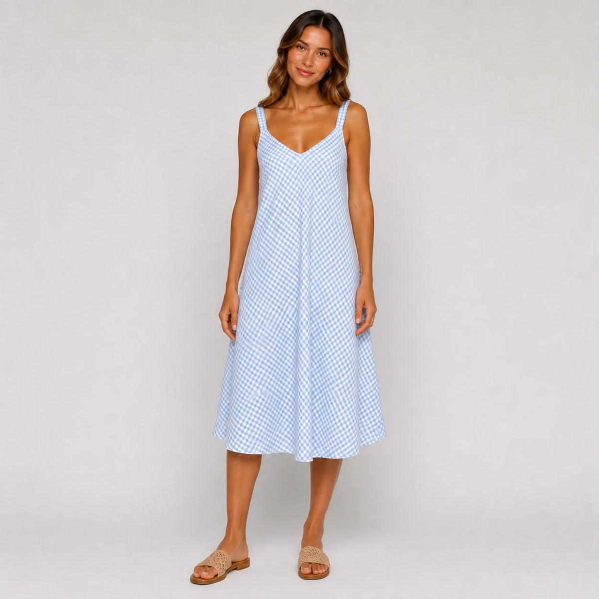 Shop our Sky Blue gingham Ladies midi cami dress, featuring a flattering V-neckline and relaxed flowing fit. A versatile summer dress perfect for holidays, brunch and everyday wear