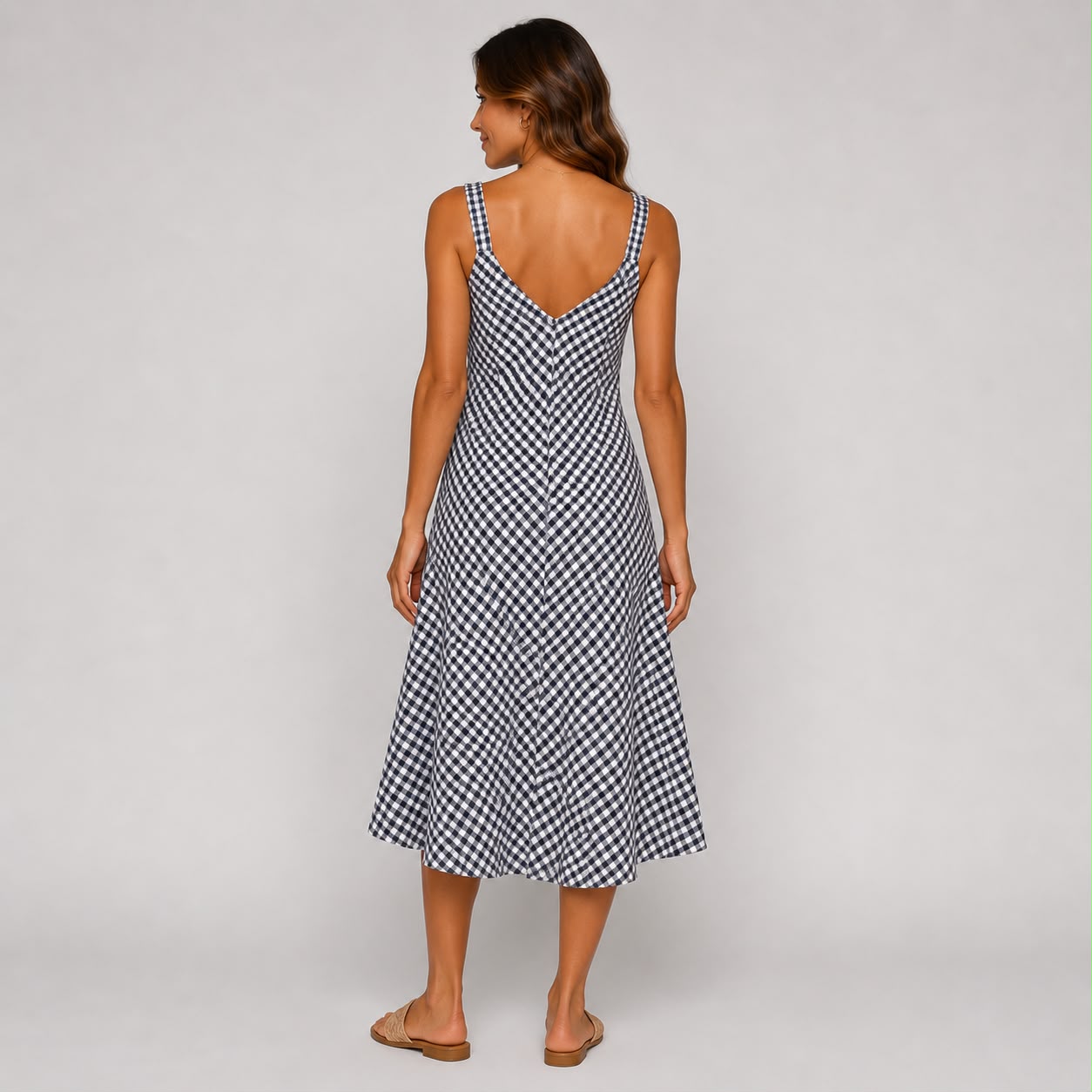 Shop our Navy gingham Ladies midi cami dress, featuring a flattering V-neckline and relaxed flowing fit. A versatile summer dress perfect for holidays, brunch and everyday wear