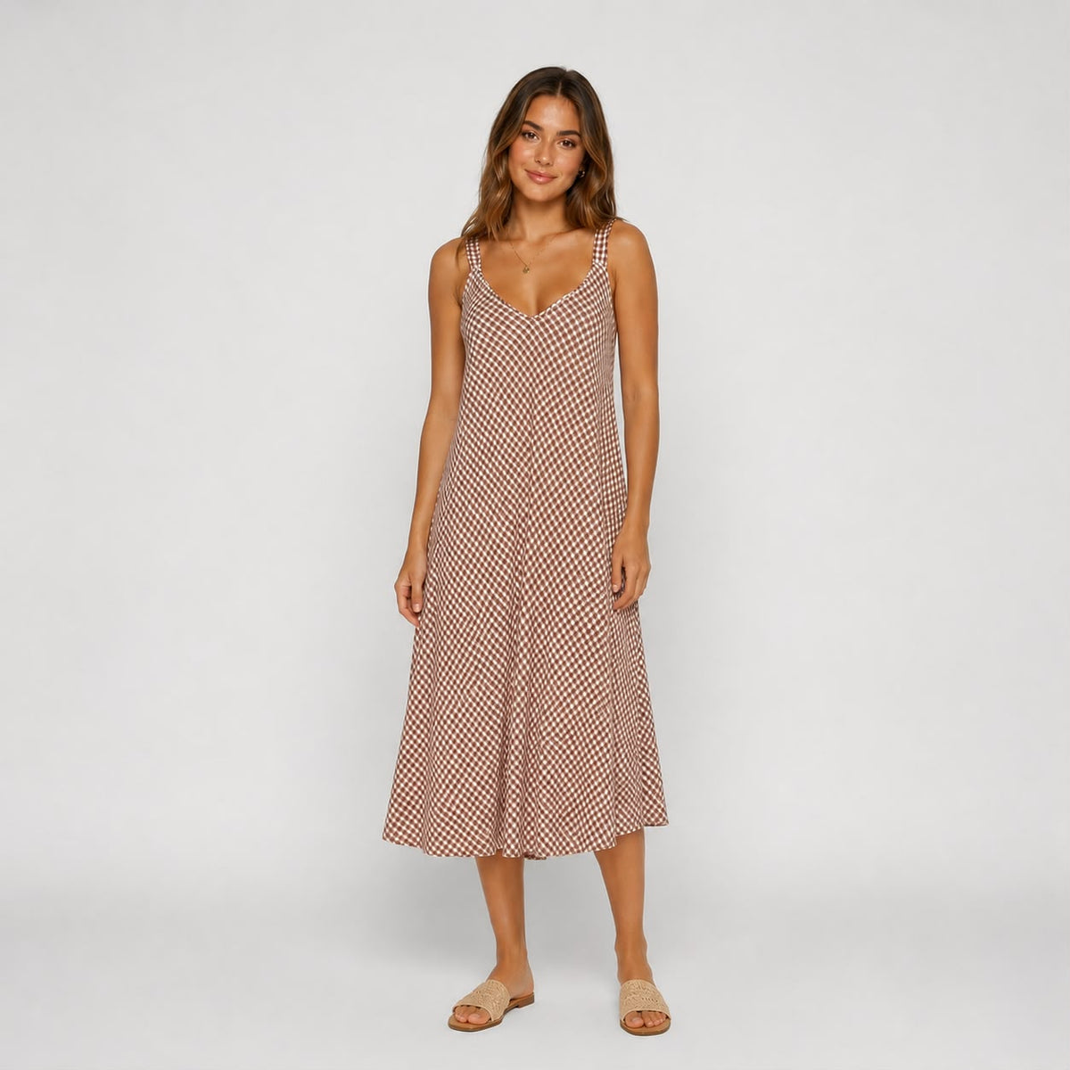 Shop our brown gingham Ladies midi cami dress, featuring a flattering V-neckline and relaxed flowing fit. A versatile summer dress perfect for holidays, brunch and everyday wear.