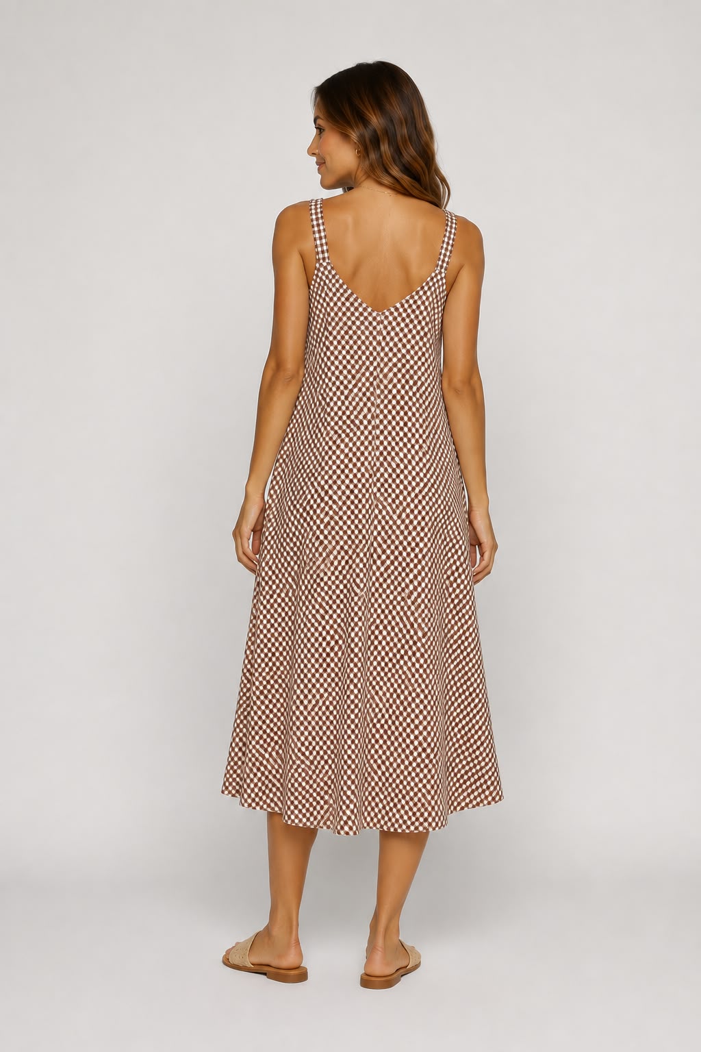 Shop our brown gingham midi cami dress, featuring a flattering V-neckline and relaxed flowing fit. A versatile summer dress perfect for holidays, brunch and everyday wear.