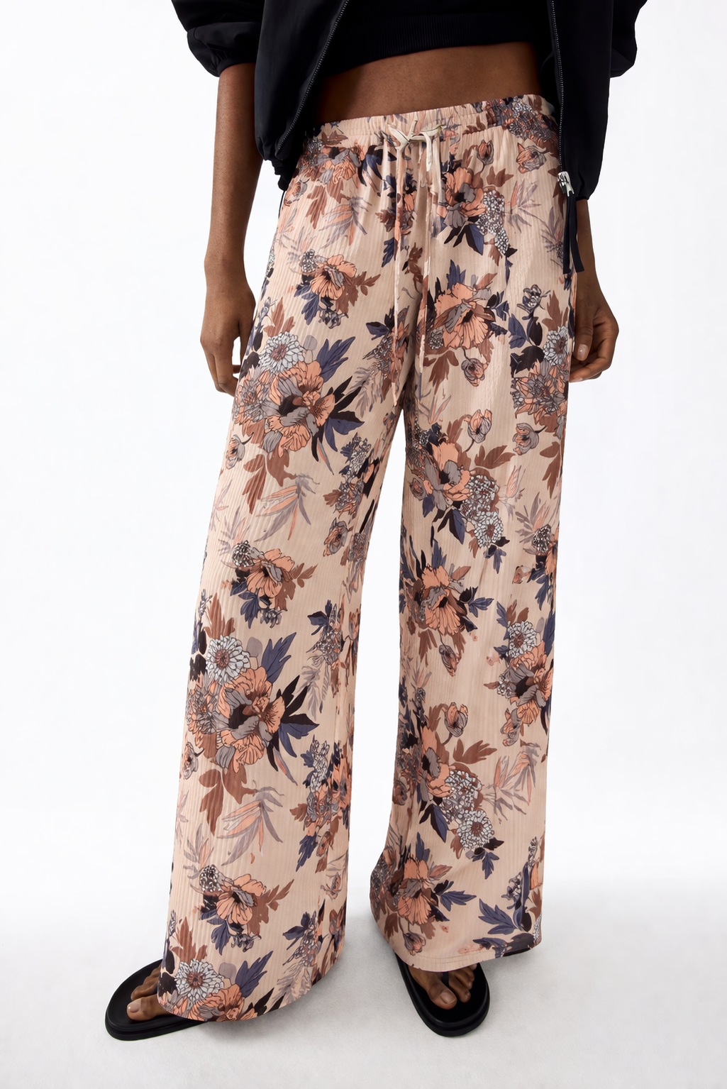 Ladies floral palazzo trousers – lightweight wide leg summer pants with beige background and pink flower pattern
