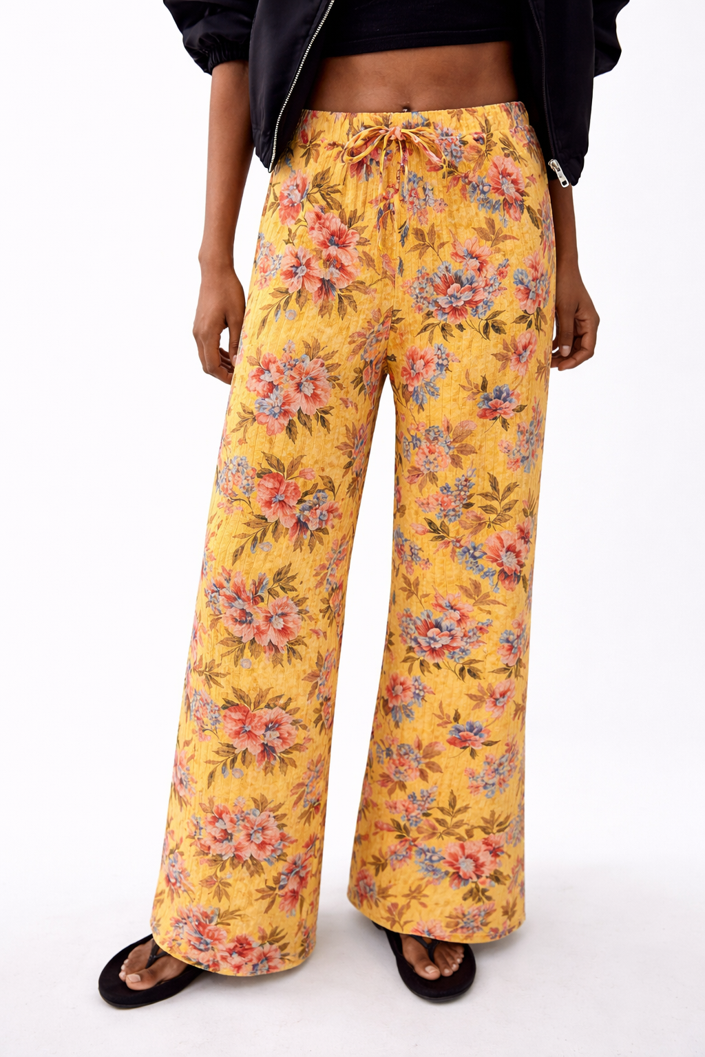 Ladies floral palazzo trousers – lightweight wide leg summer pants with yellow background and pink flower pattern