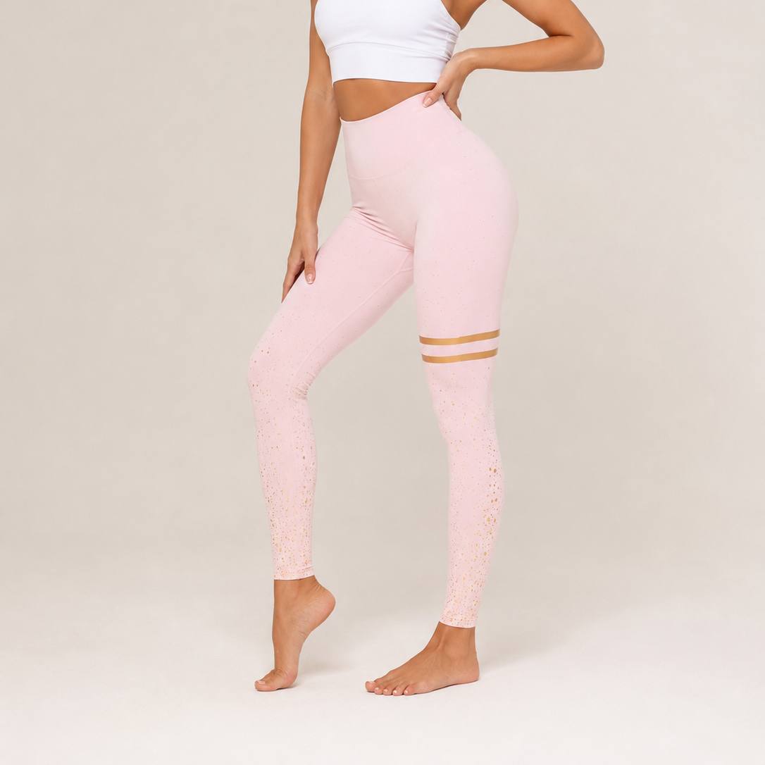 Ladies soft pink high-waisted leggings with gold stripes and glitter detail for women.