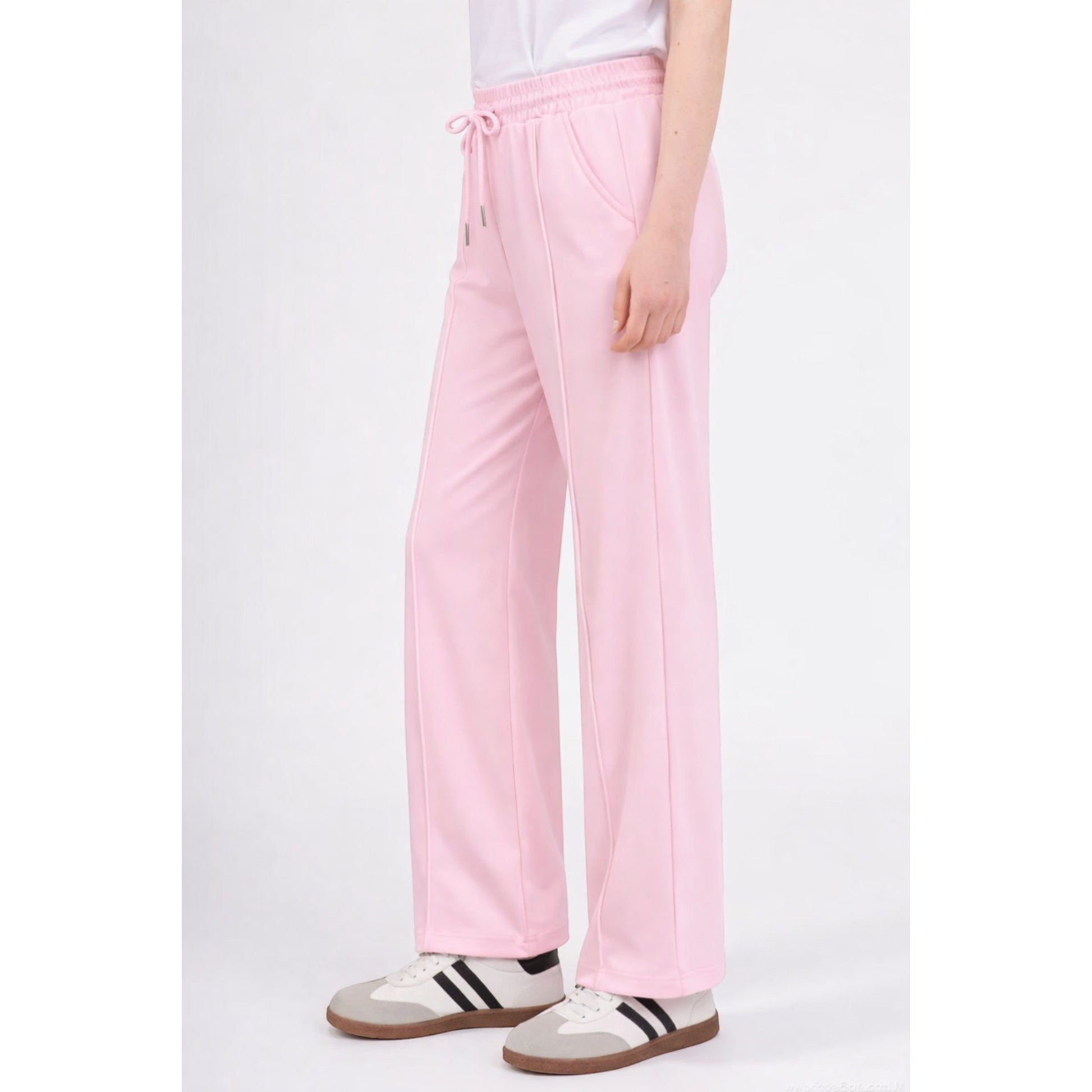 Upgrade your everyday wardrobe with these ultra-comfortable and effortlessly stylish wide leg trousers. Designed with a flattering high-rise elastic waistband and adjustable drawstring tie, these trousers combine comfort and elegance in one easy-to-wear piece.