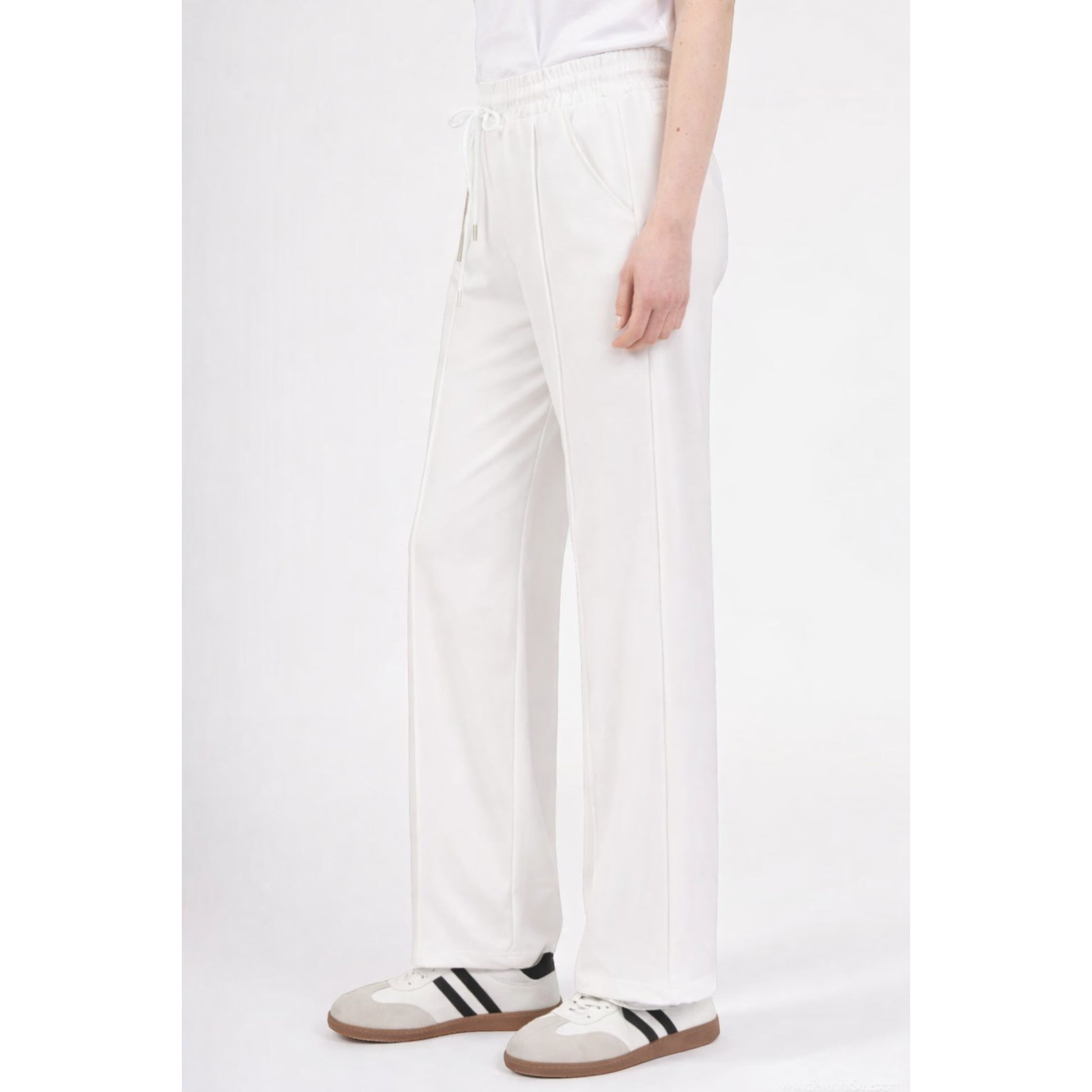 Upgrade your everyday wardrobe with these ultra-comfortable and effortlessly stylish wide leg trousers. Designed with a flattering high-rise elastic waistband and adjustable drawstring tie, these trousers combine comfort and elegance in one easy-to-wear piece.