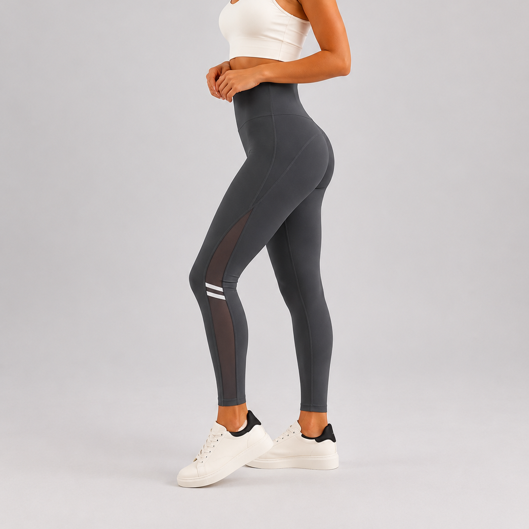 Women's grey comfort fit leggings with sheer mesh side panels and white stripe detail
