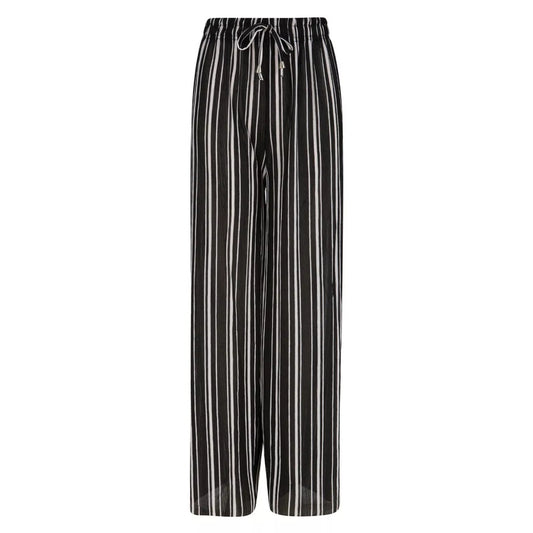 Women’s black and white striped harem palazzo trousers with drawstring waist.