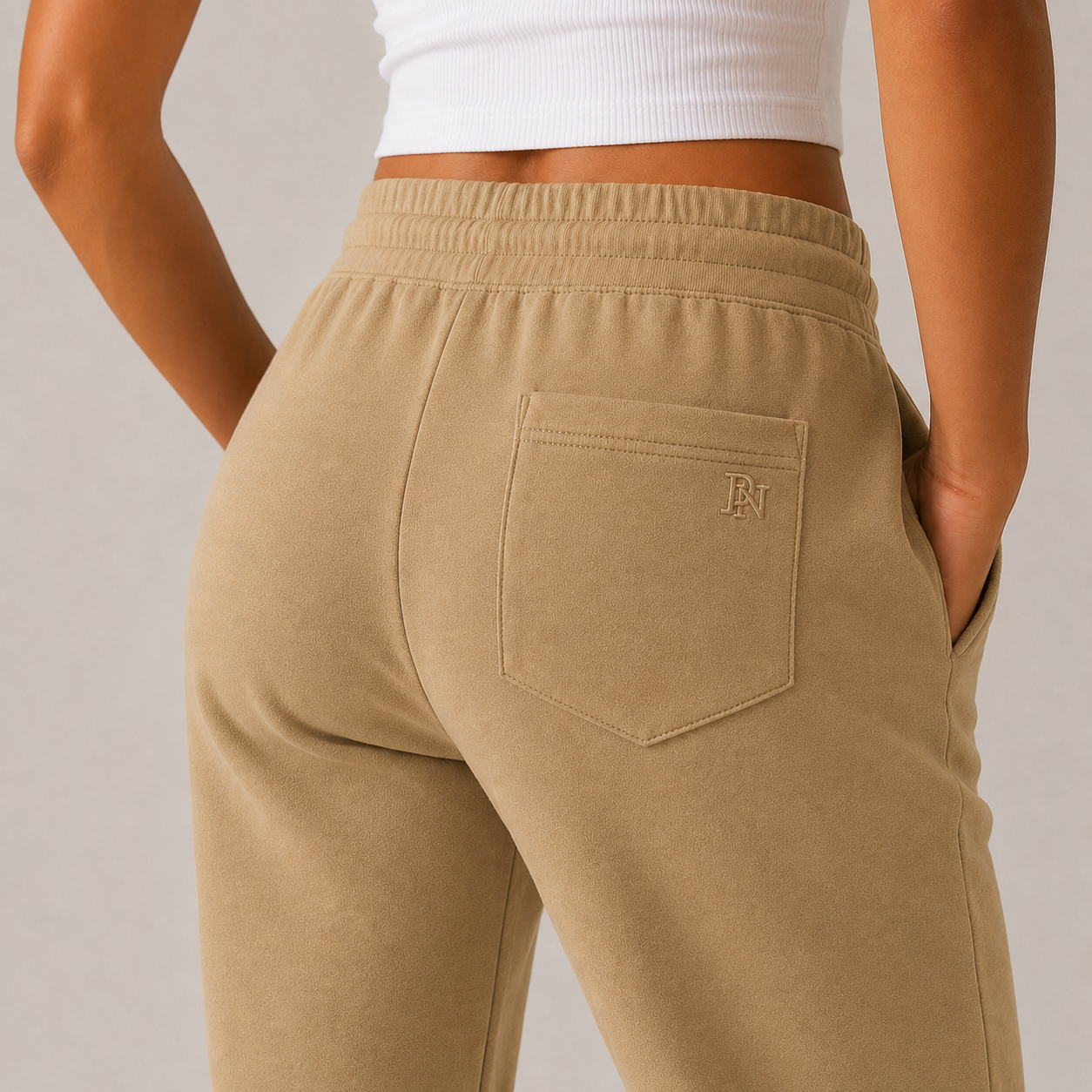 Women’s beige high-waisted joggers with drawstring waist and cuffed ankles – soft loungewear trousers