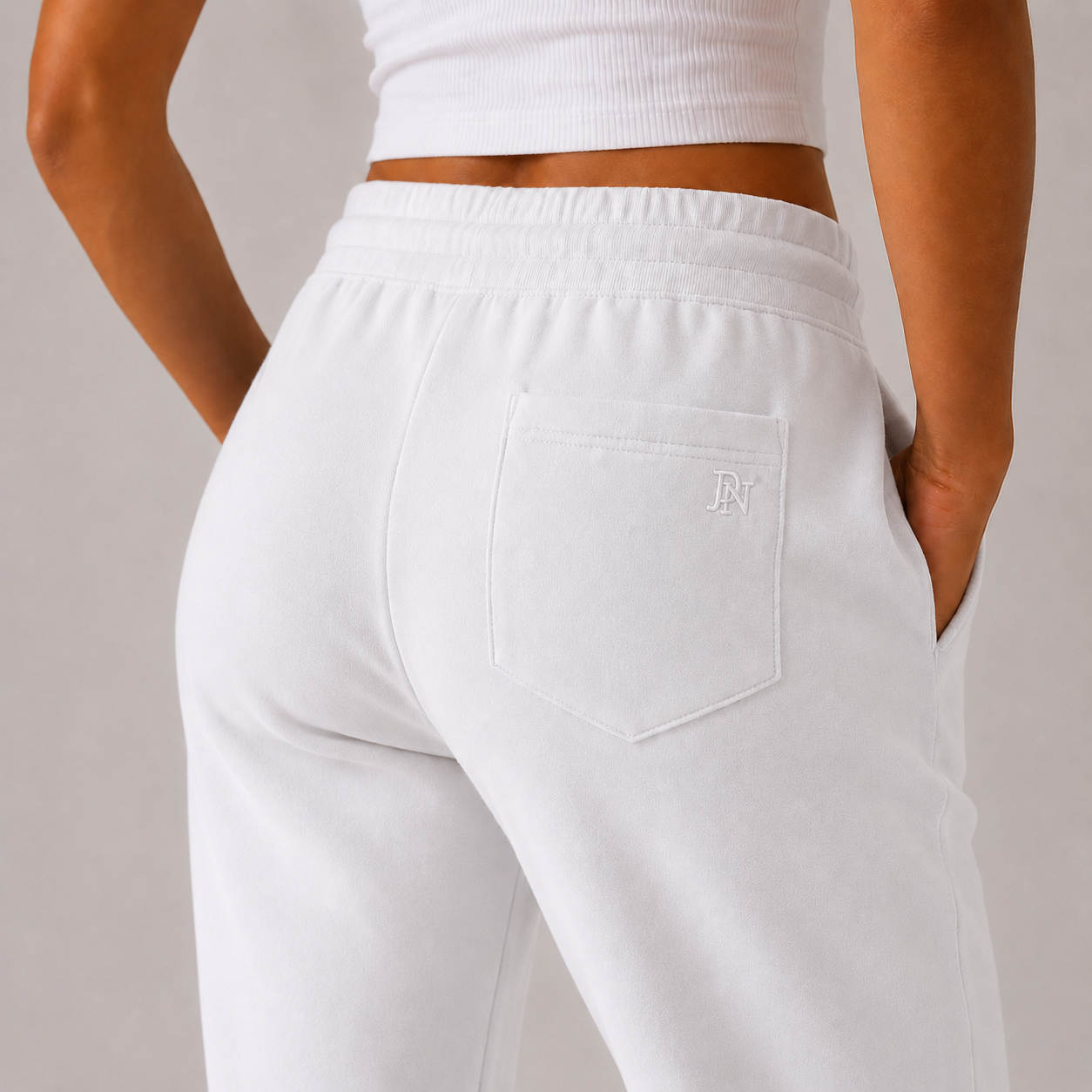 Women’s white high-waisted joggers with drawstring waist and cuffed ankles – soft loungewear trousers