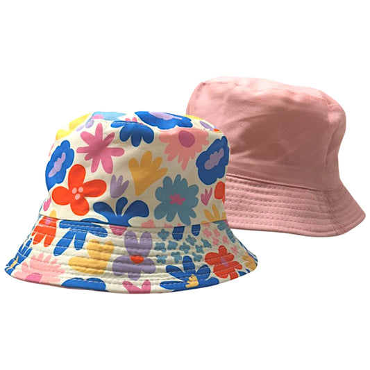 Kids reversible bucket hat with colorful floral print on one side and solid pastel pink on the other, lightweight cotton sun hat for boys and girls.