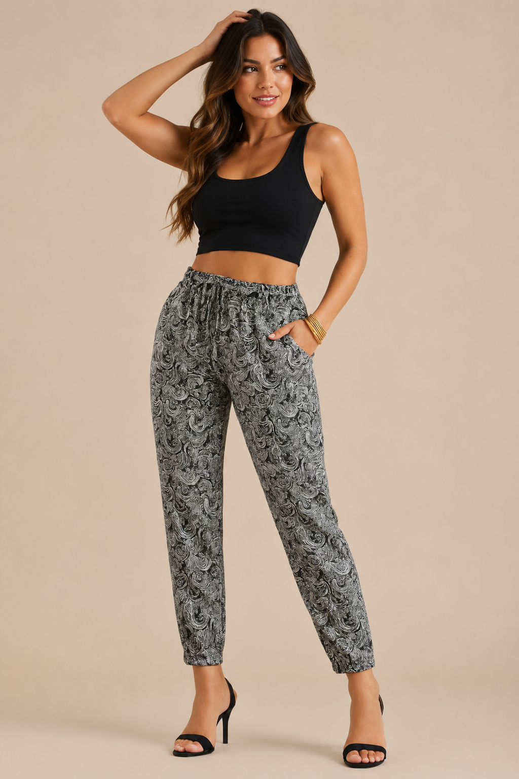 Women’s black paisley print tapered trousers with elasticated drawstring waist and side pockets
