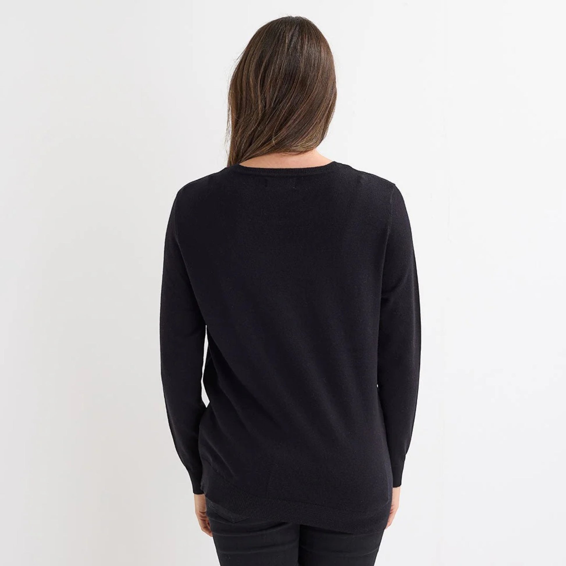 Ladies black Christmas jumper with sequin star, bow and bauble design, long sleeves and a festive look.