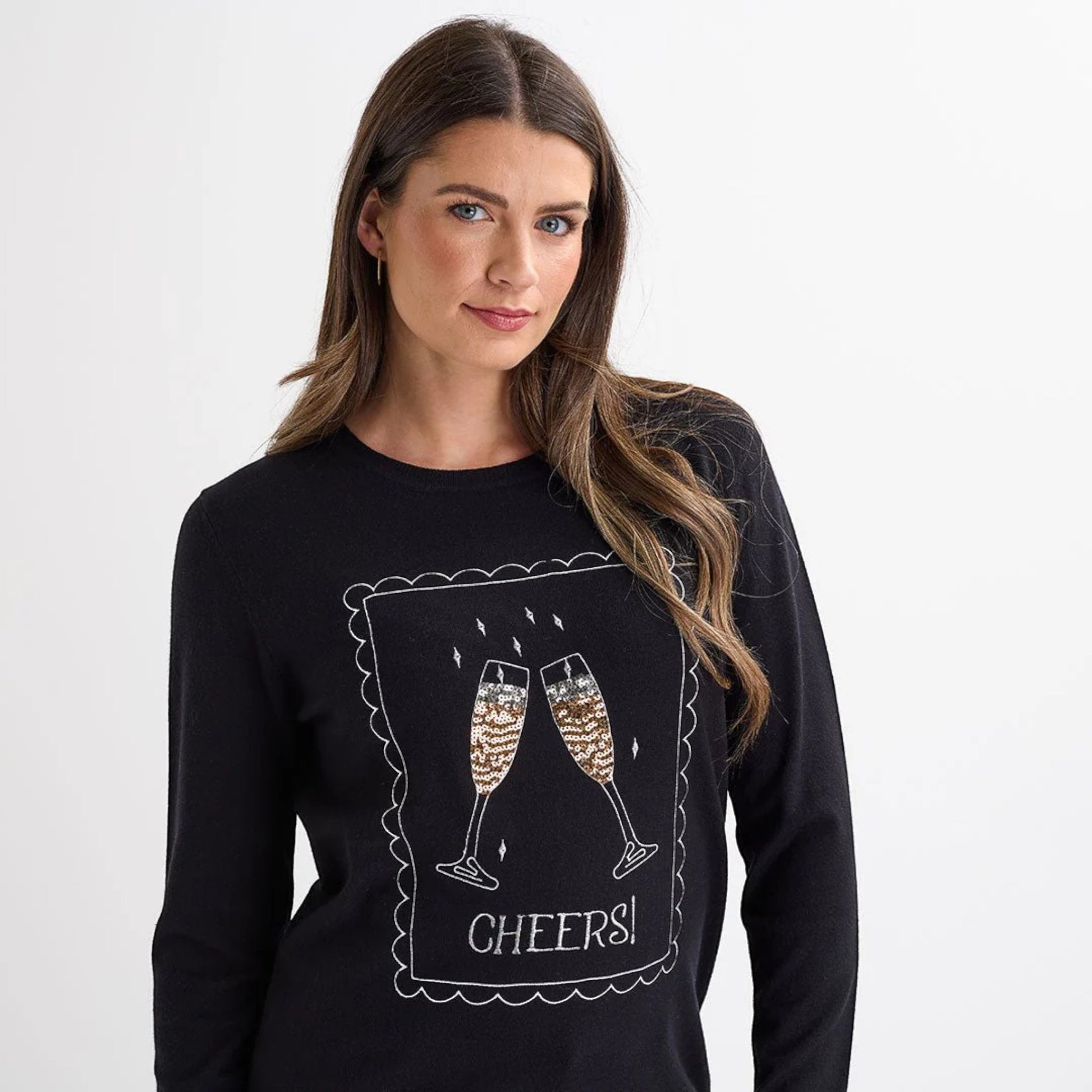 Ladies black christmas jumper with sequin champagne glasses and ‘Cheers!’ slogan, long sleeves and a festive xmas design.