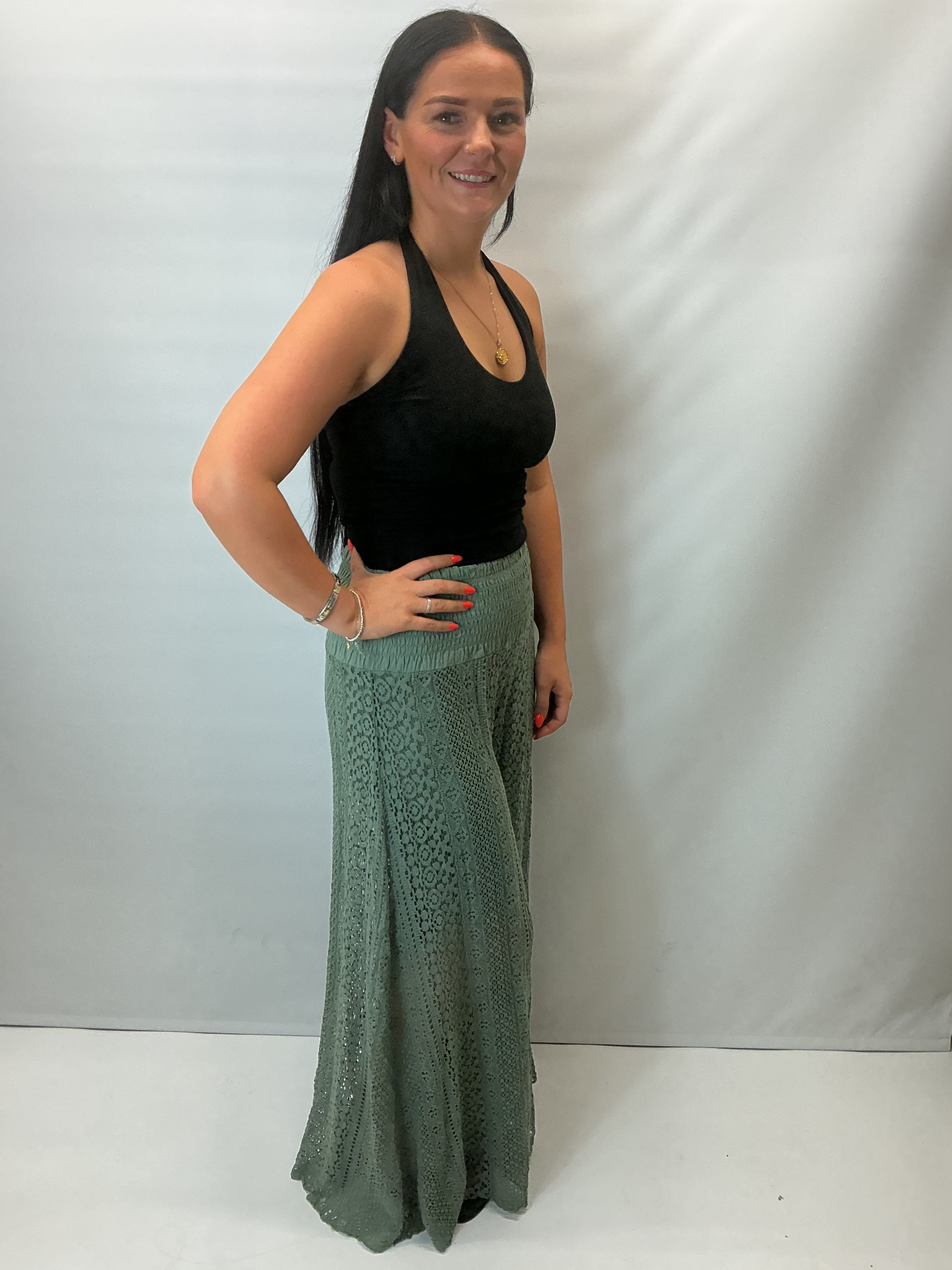 Upgrade your summer wardrobe with our lace wide leg trousers, designed for effortless style and all-day comfort. Featuring a high-waisted smocked waistband and a flowing wide-leg silhouette, these trousers create a flattering, elongating fit perfect for warm-weather dressing.