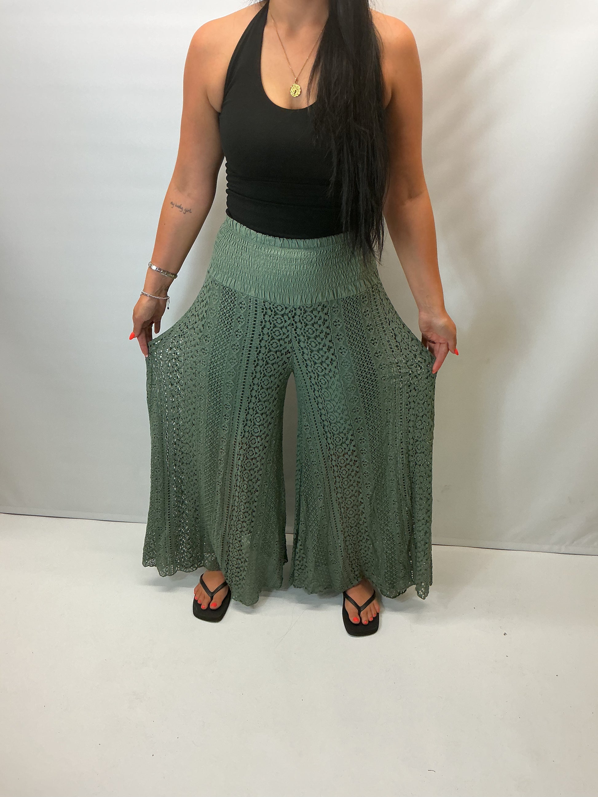 Upgrade your summer wardrobe with our lace wide leg trousers, designed for effortless style and all-day comfort. Featuring a high-waisted smocked waistband and a flowing wide-leg silhouette, these trousers create a flattering, elongating fit perfect for warm-weather dressing.