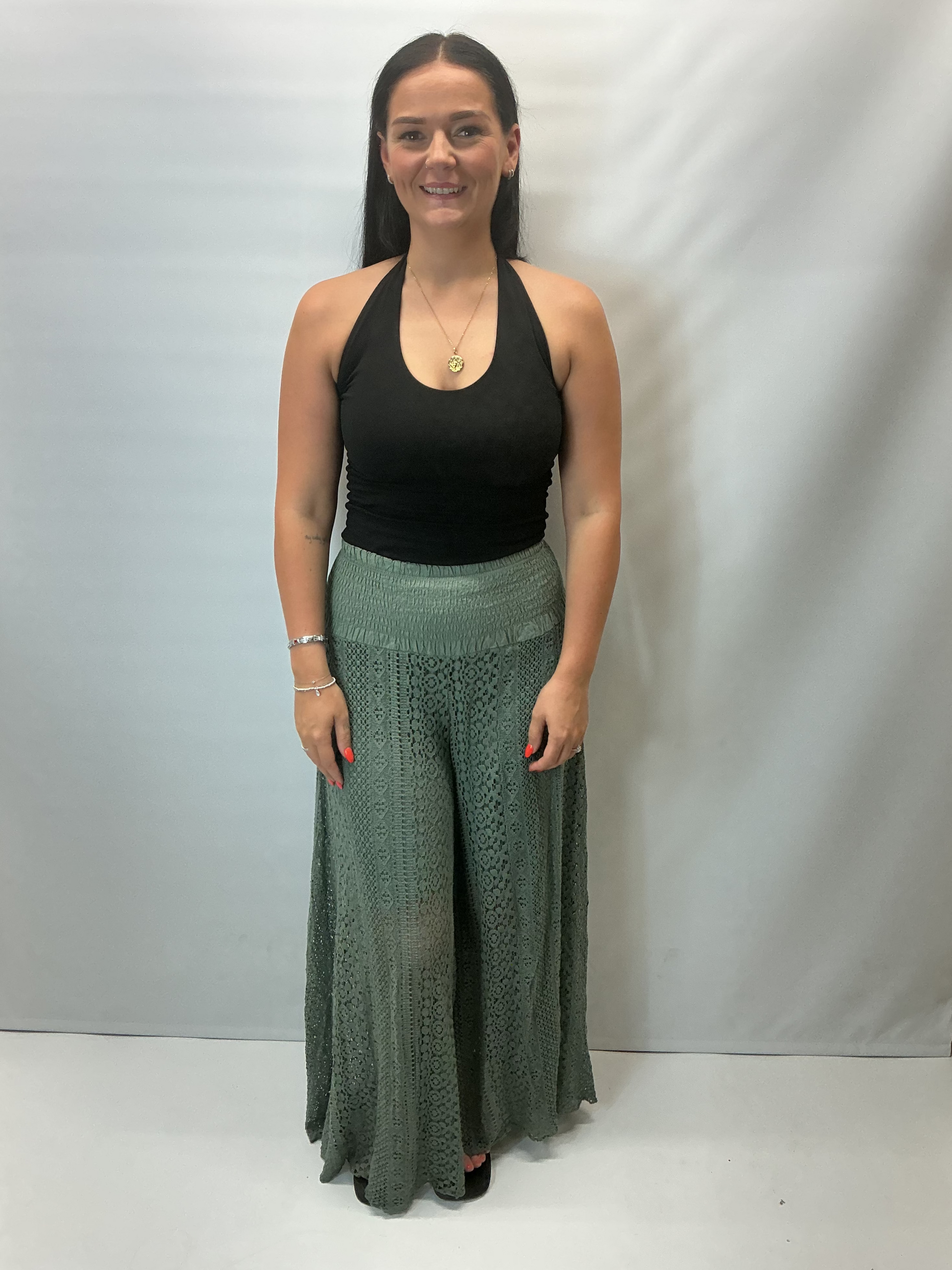 Upgrade your summer wardrobe with our lace wide leg trousers, designed for effortless style and all-day comfort. Featuring a high-waisted smocked waistband and a flowing wide-leg silhouette, these trousers create a flattering, elongating fit perfect for warm-weather dressing.