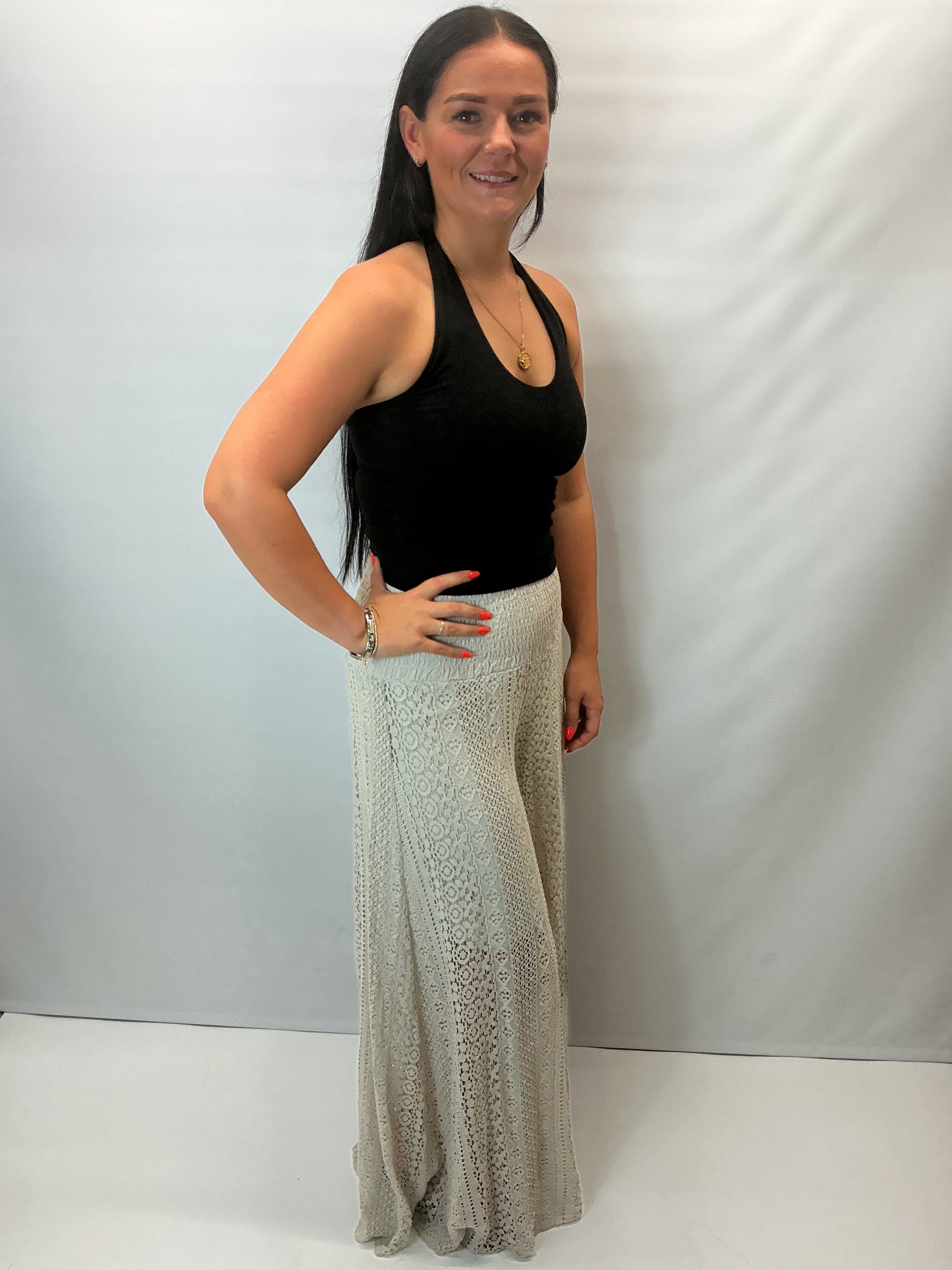 Upgrade your summer wardrobe with our lace wide leg trousers, designed for effortless style and all-day comfort. Featuring a high-waisted smocked waistband and a flowing wide-leg silhouette, these trousers create a flattering, elongating fit perfect for warm-weather dressing.