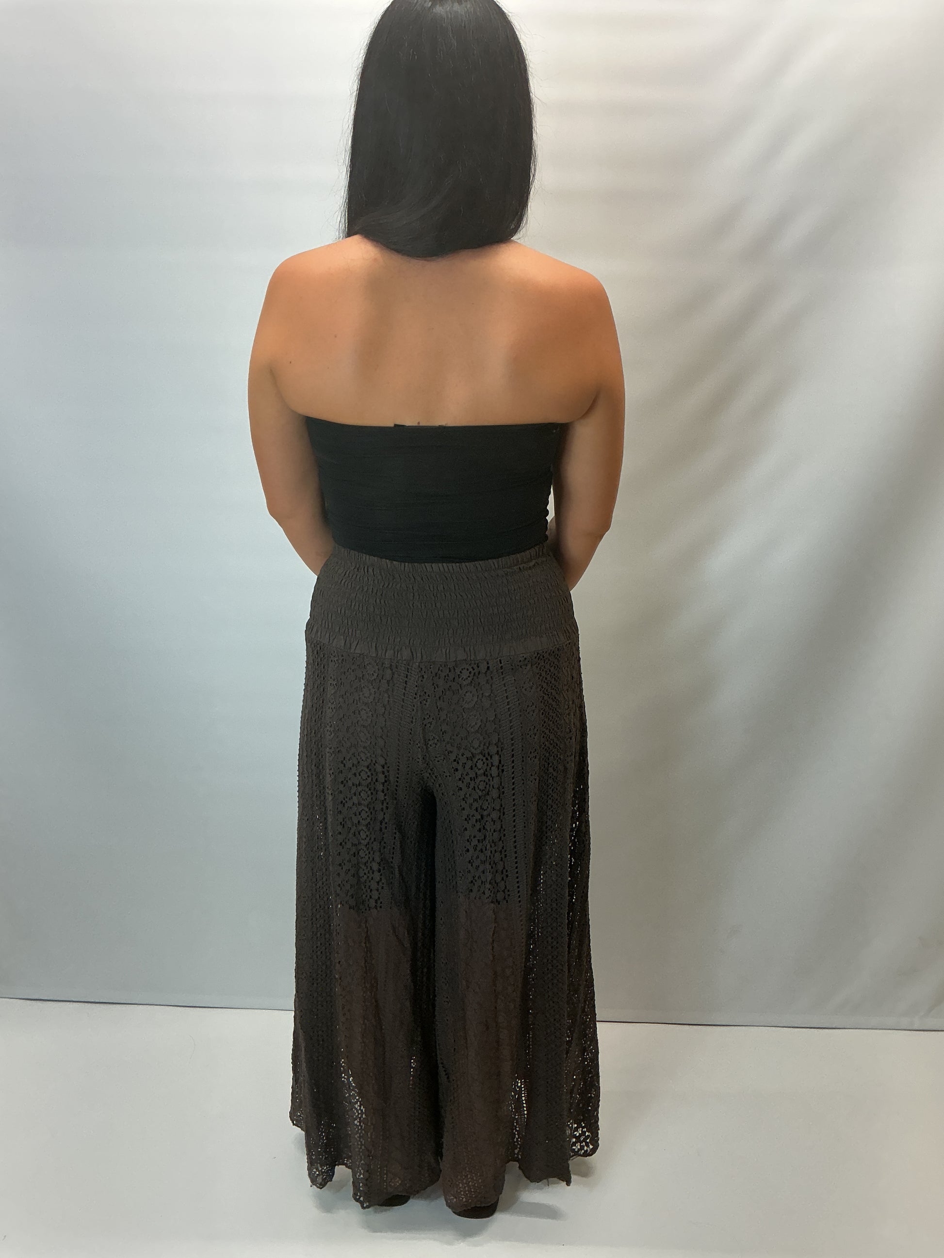 Upgrade your summer wardrobe with our lace wide leg trousers, designed for effortless style and all-day comfort. Featuring a high-waisted smocked waistband and a flowing wide-leg silhouette, these trousers create a flattering, elongating fit perfect for warm-weather dressing.