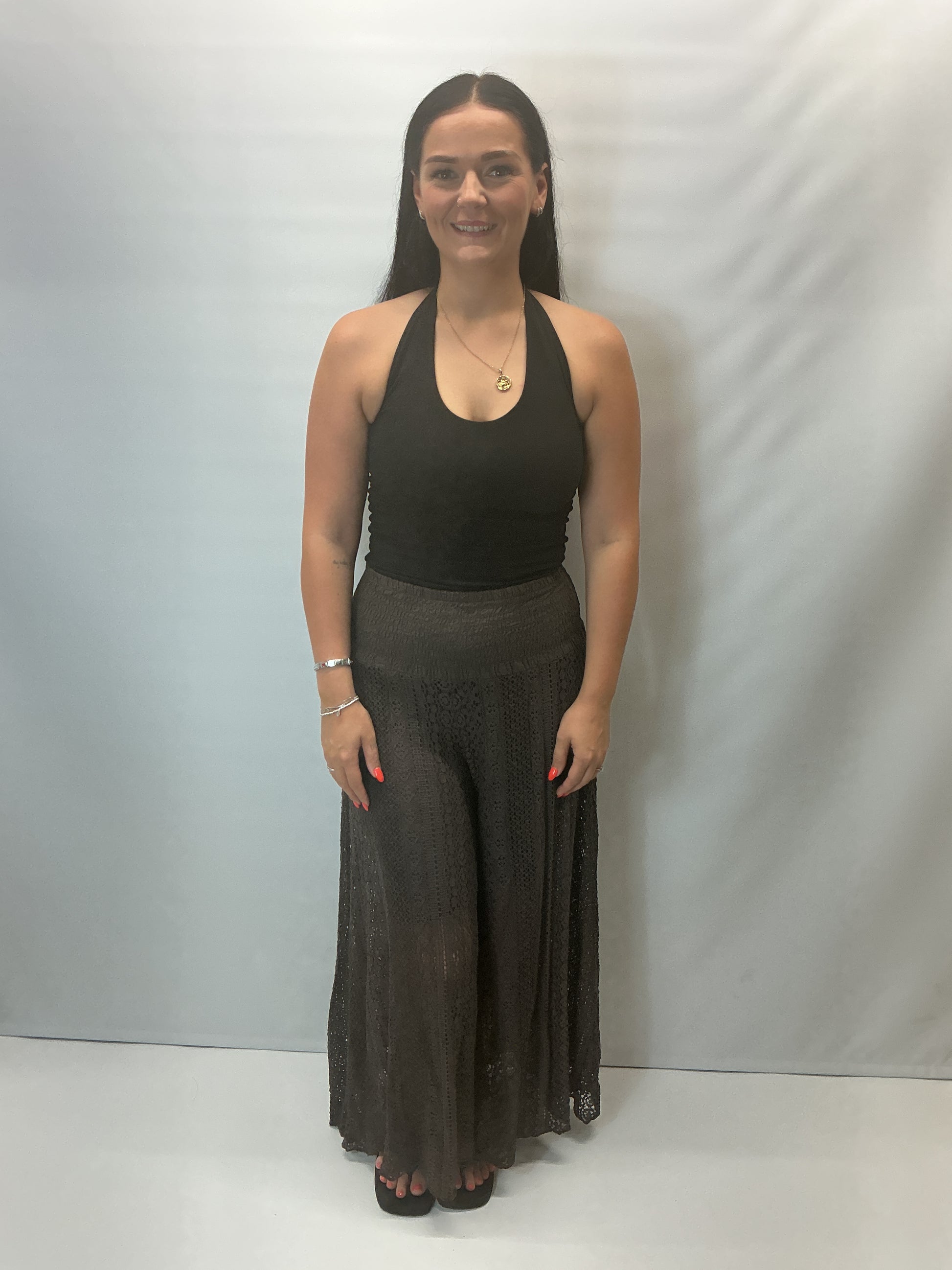 Upgrade your summer wardrobe with our lace wide leg trousers, designed for effortless style and all-day comfort. Featuring a high-waisted smocked waistband and a flowing wide-leg silhouette, these trousers create a flattering, elongating fit perfect for warm-weather dressing.
