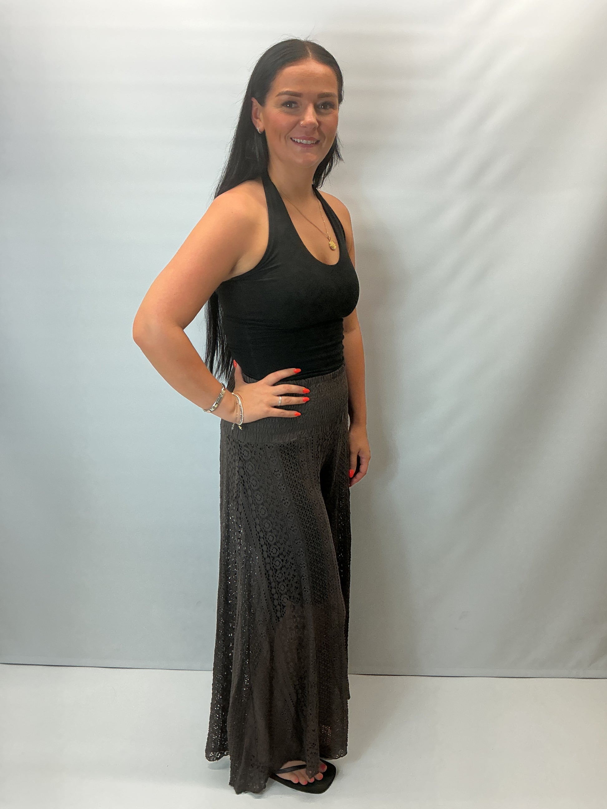 Upgrade your summer wardrobe with our lace wide leg trousers, designed for effortless style and all-day comfort. Featuring a high-waisted smocked waistband and a flowing wide-leg silhouette, these trousers create a flattering, elongating fit perfect for warm-weather dressing.