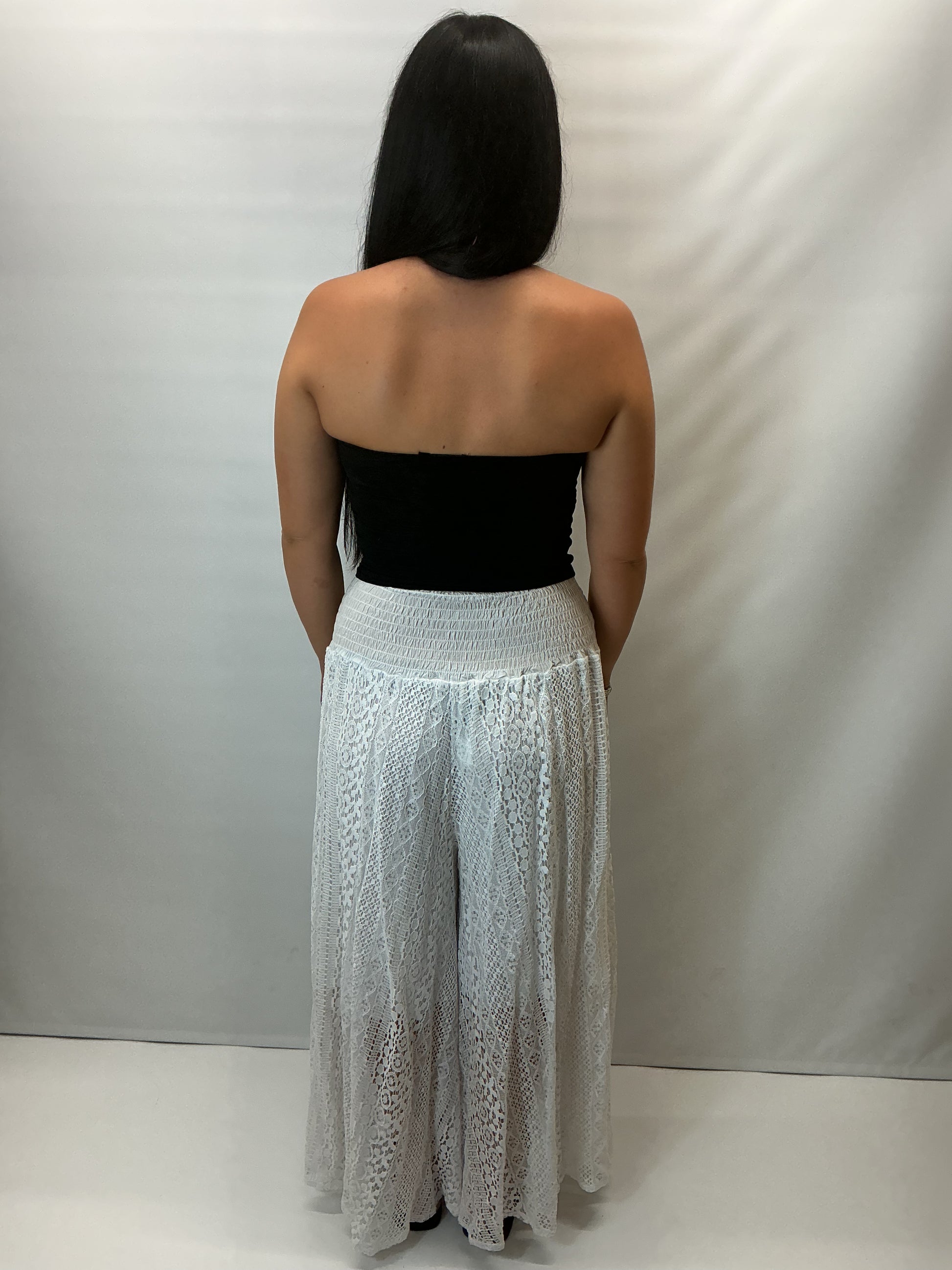Upgrade your summer wardrobe with our lace wide leg trousers, designed for effortless style and all-day comfort. Featuring a high-waisted smocked waistband and a flowing wide-leg silhouette, these trousers create a flattering, elongating fit perfect for warm-weather dressing.