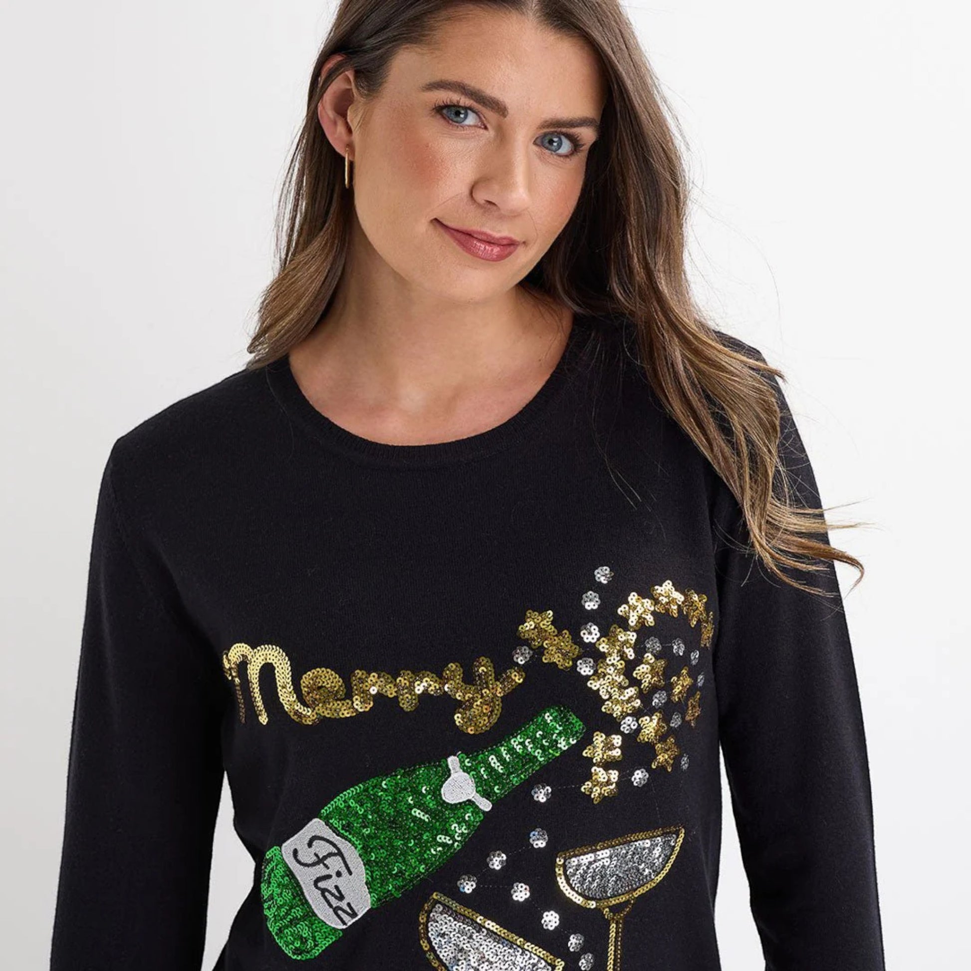 Ladies black Christmas jumper with sequin ‘Merry Fizzmas’ slogan, champagne bottle and glasses design, long sleeves and festive xmas style.