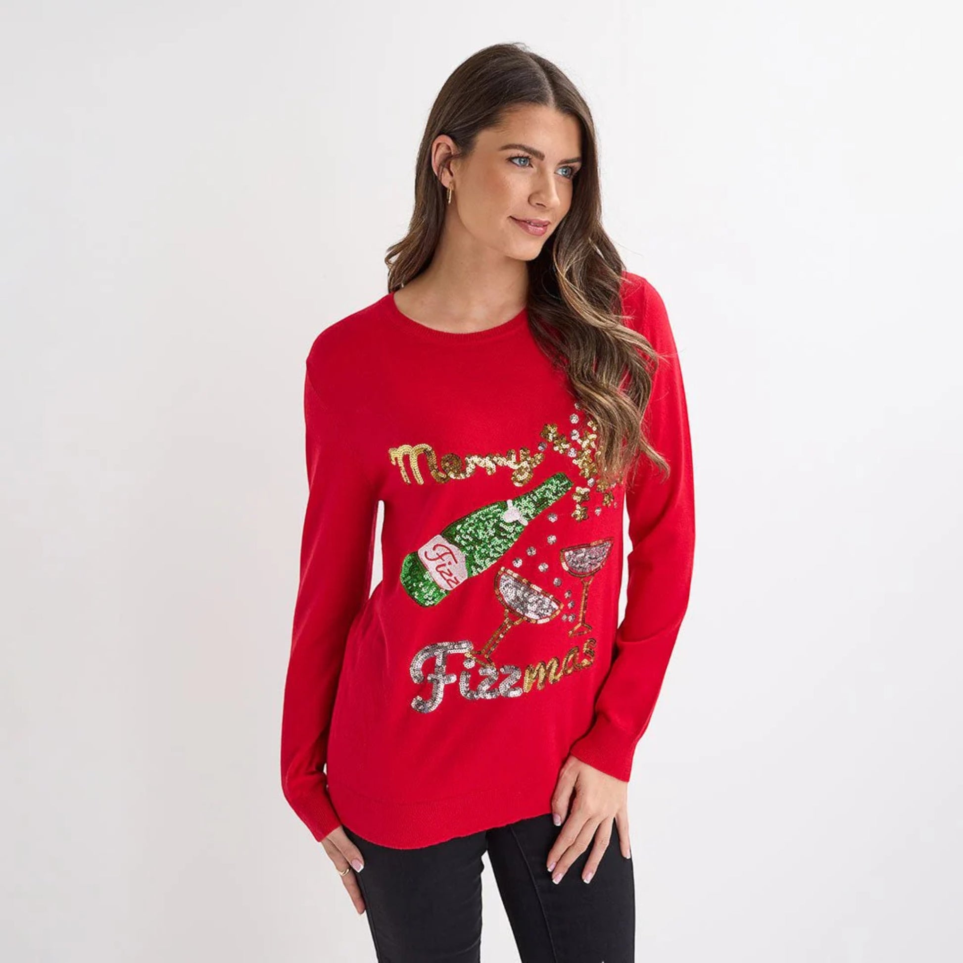 Ladies red Christmas jumper with sequin ‘Merry Fizzmas’ slogan, champagne bottle and glasses design, long sleeves and festive xmas style.