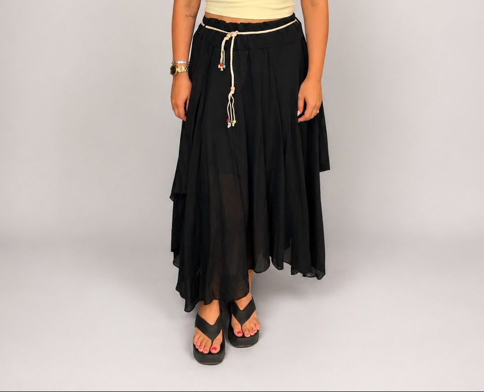 Ladies Italian boho maxi skirt in Black with an asymmetric hem, elasticated drawstring waistband and flowing relaxed fit.