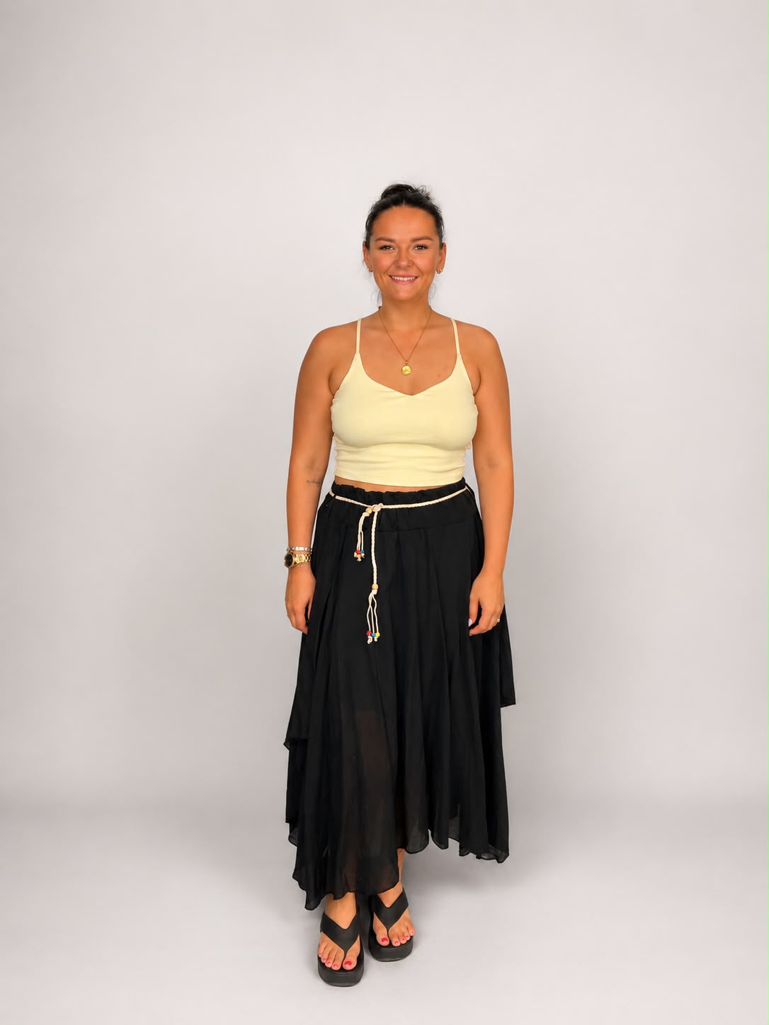 Ladies Italian boho maxi skirt in Black with an asymmetric hem, elasticated drawstring waistband and flowing relaxed fit 