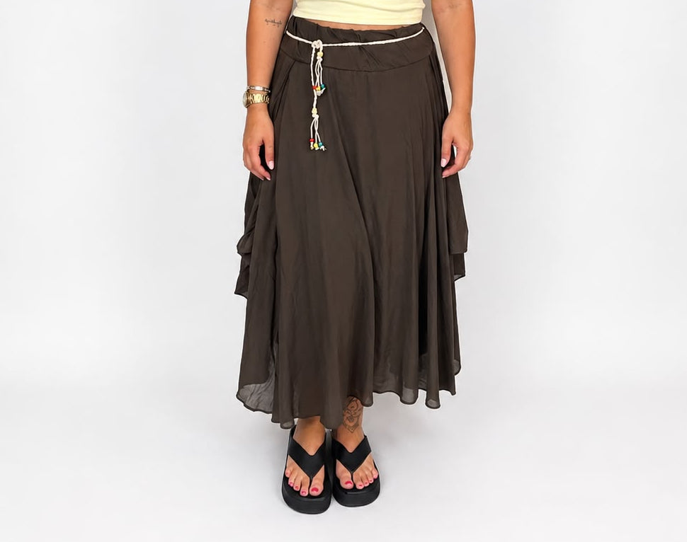 Ladies Italian boho maxi skirt in Brown with an asymmetric hem, elasticated drawstring waistband and flowing relaxed fit.