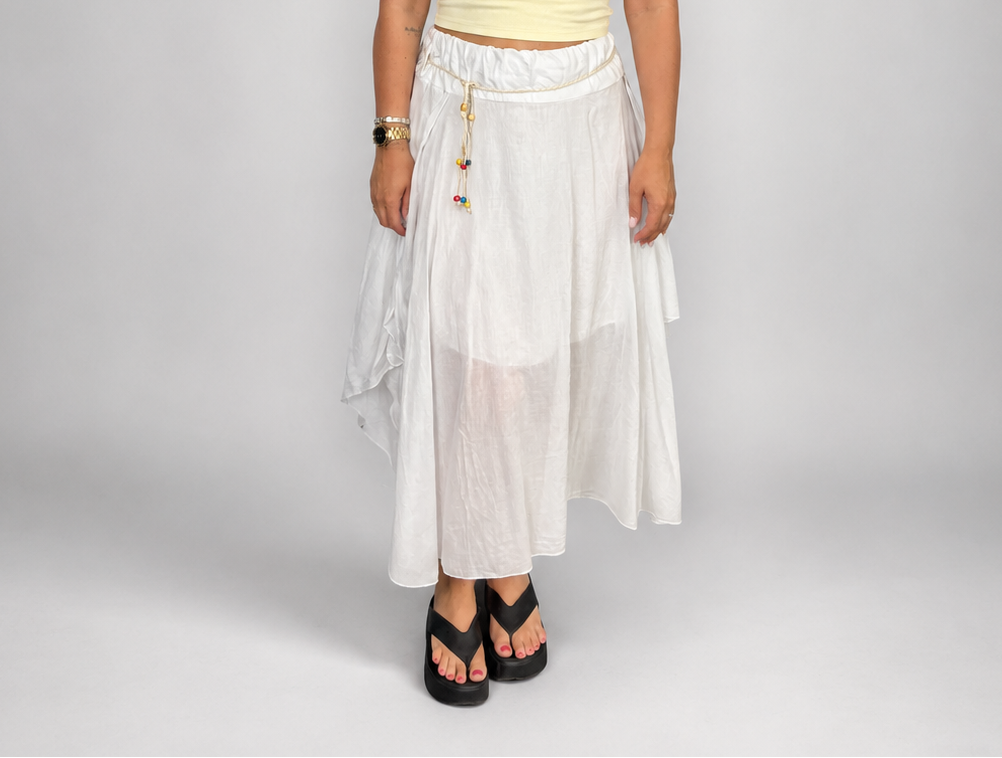 Ladies Italian boho maxi skirt in White with an asymmetric hem, elasticated drawstring waistband and flowing relaxed fit.