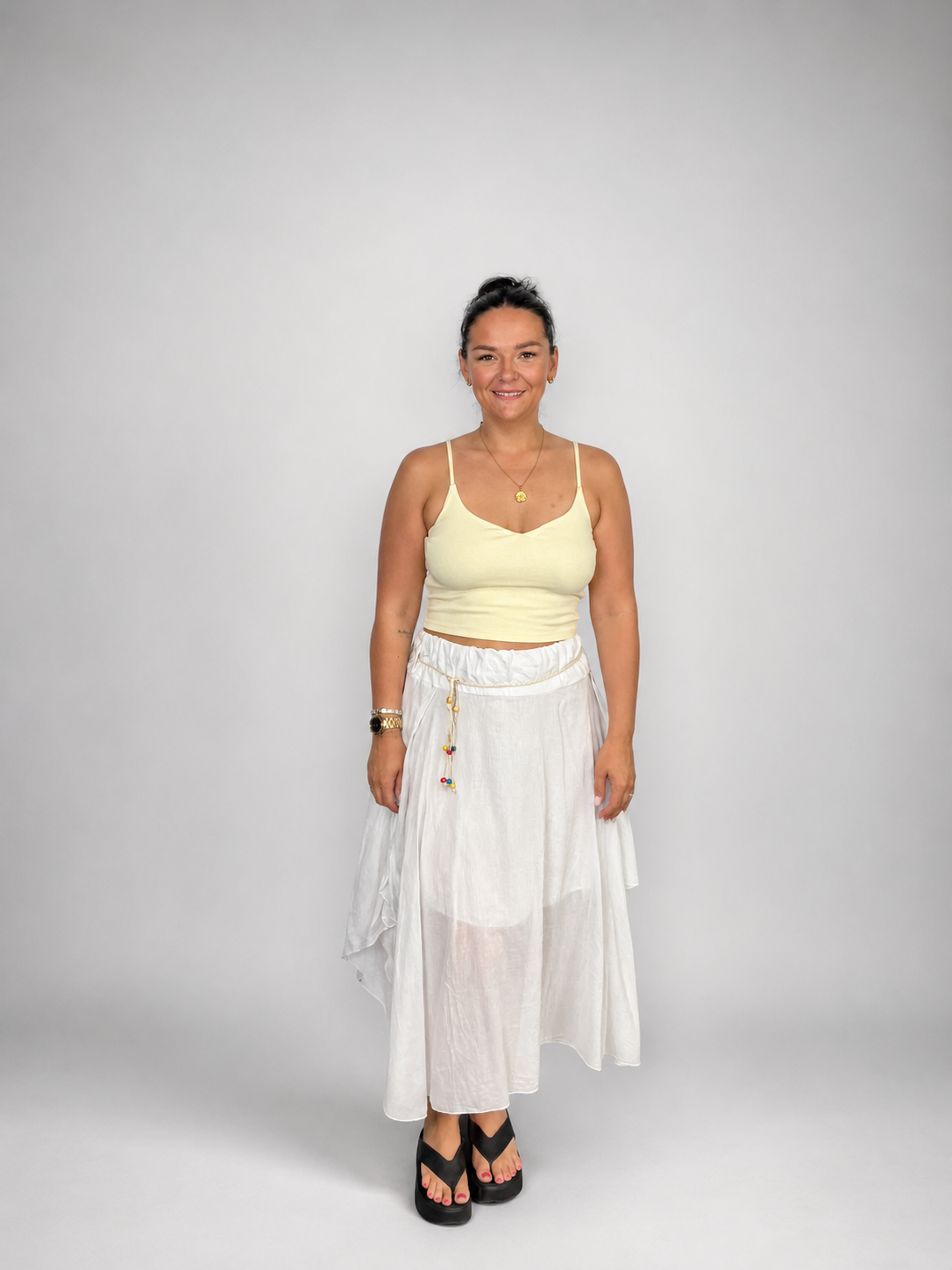 Ladies Italian boho maxi skirt in White with an asymmetric hem, elasticated drawstring waistband and flowing relaxed fit.