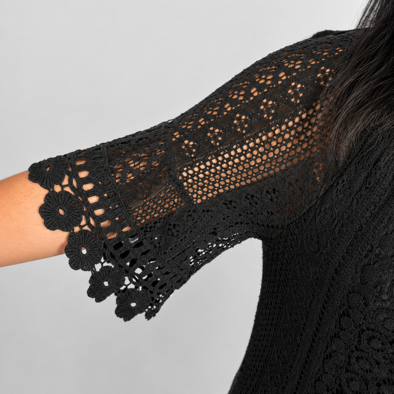 Ladies Italian Daisy Crochet Lace Tunic Top in black with floral crochet lace detail and short scalloped sleeves.