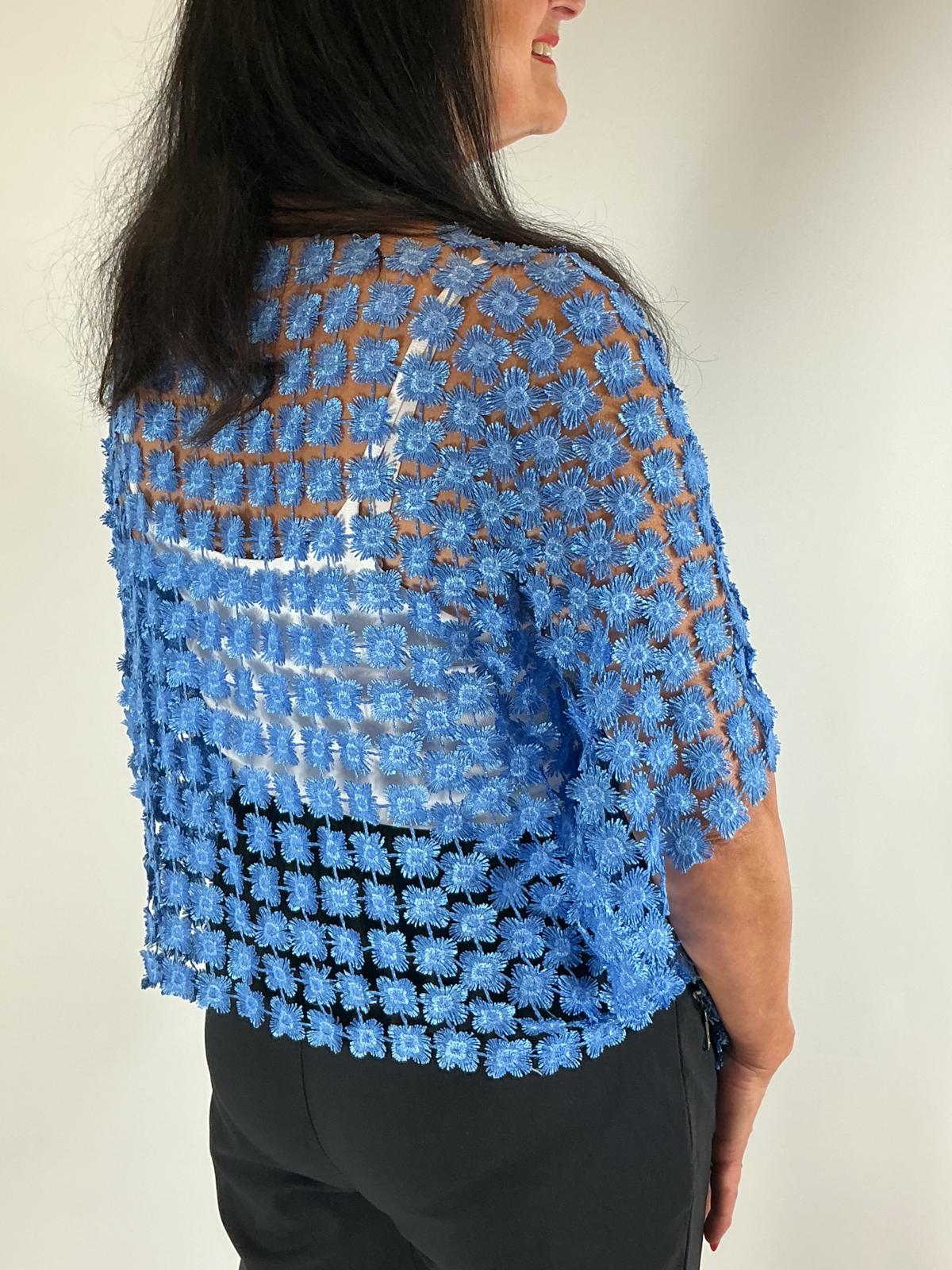 Ladies Blue semi-sheer floral embroidered top with short sleeves, a relaxed fit and scalloped edges